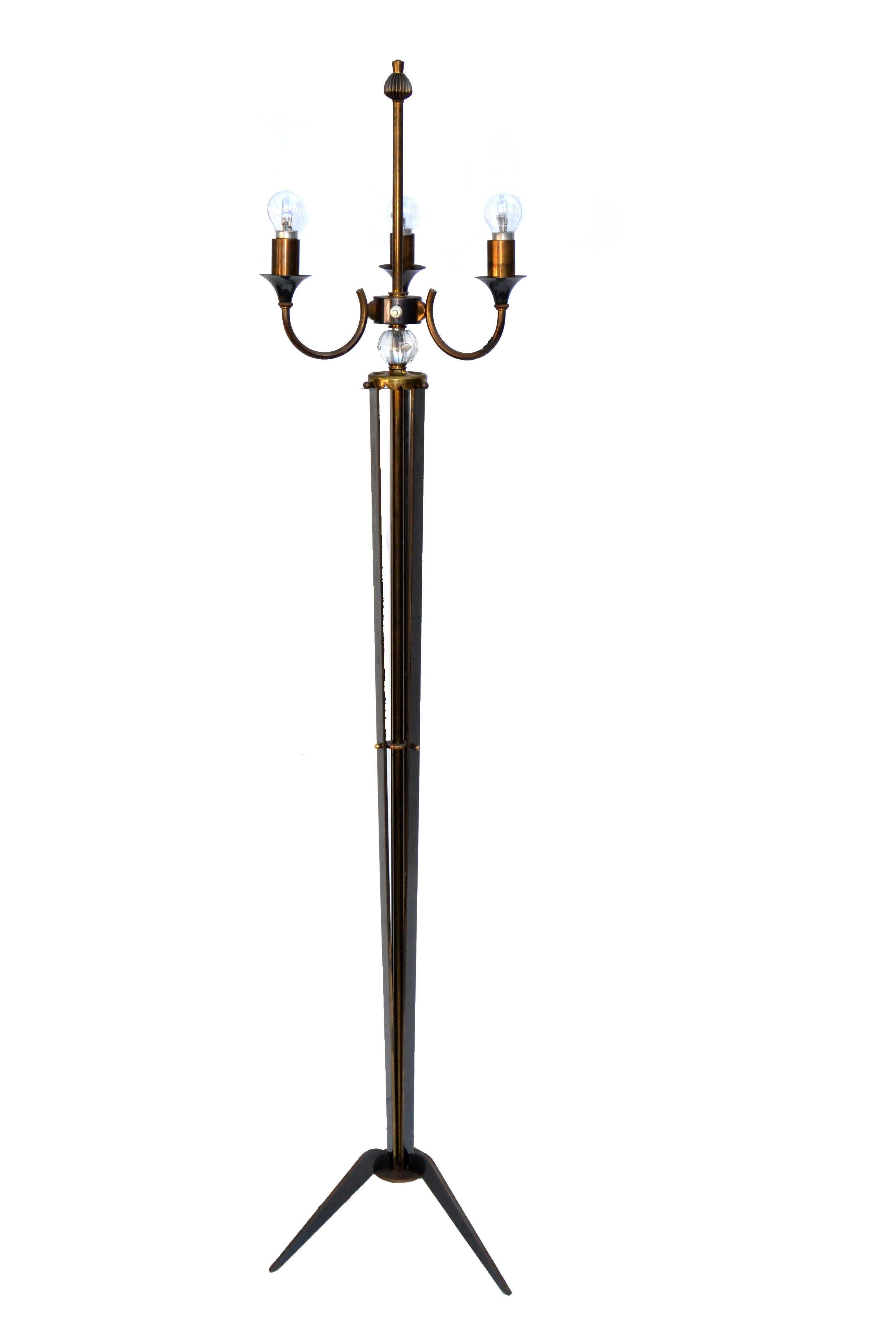 Pair of Neoclassical Maison Jansen style floor lamp in two patina, brass & gun metal finish with crystal cups at the 3-arm light top, mounted on a tripod base.
Has an on/off switch at the Top.
Takes 3 light bulbs with max. 40 watts each.
Shade