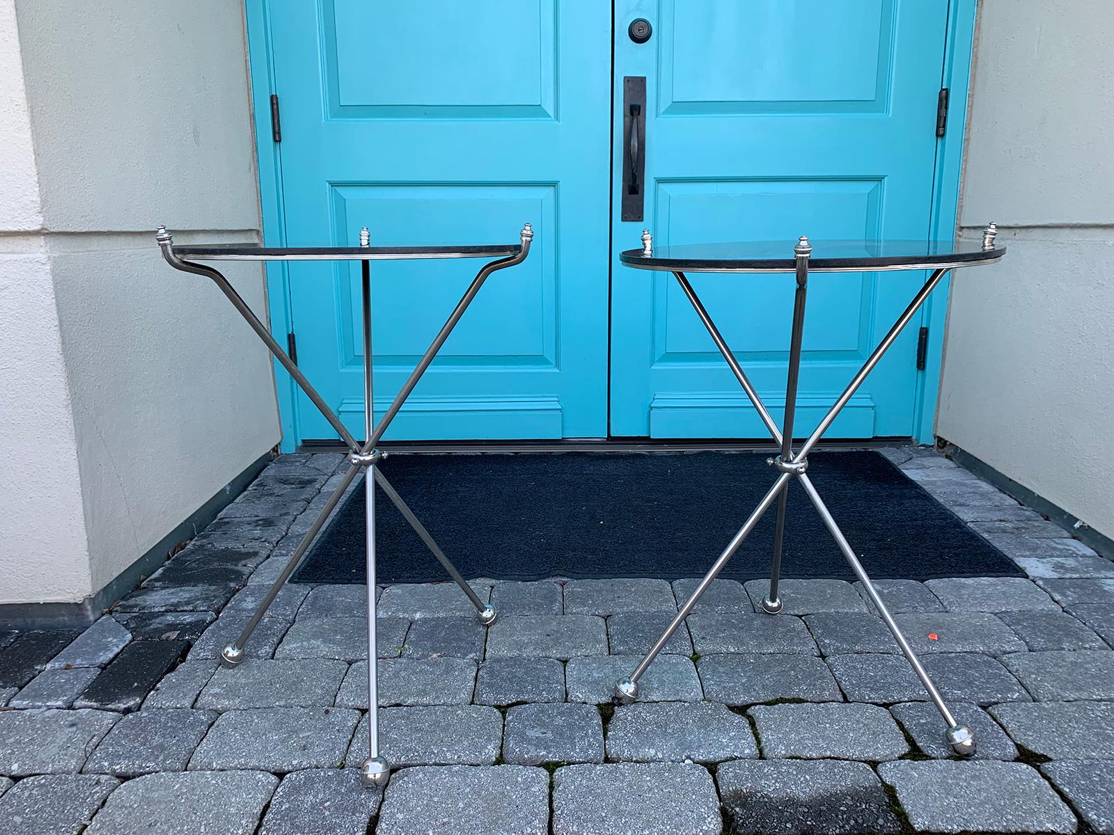 Pair of round mid-20th century Italian steel folding tripod side tables with marble tops
In the style of Maison Jansen
Measures: 21