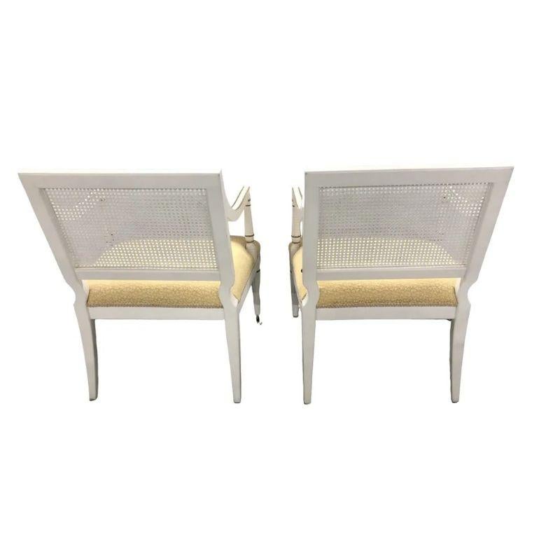 Pair of Maison Jansen Style Louis XVI Caned Painted Arm Chairs with Gilt In Good Condition In Locust Valley, NY