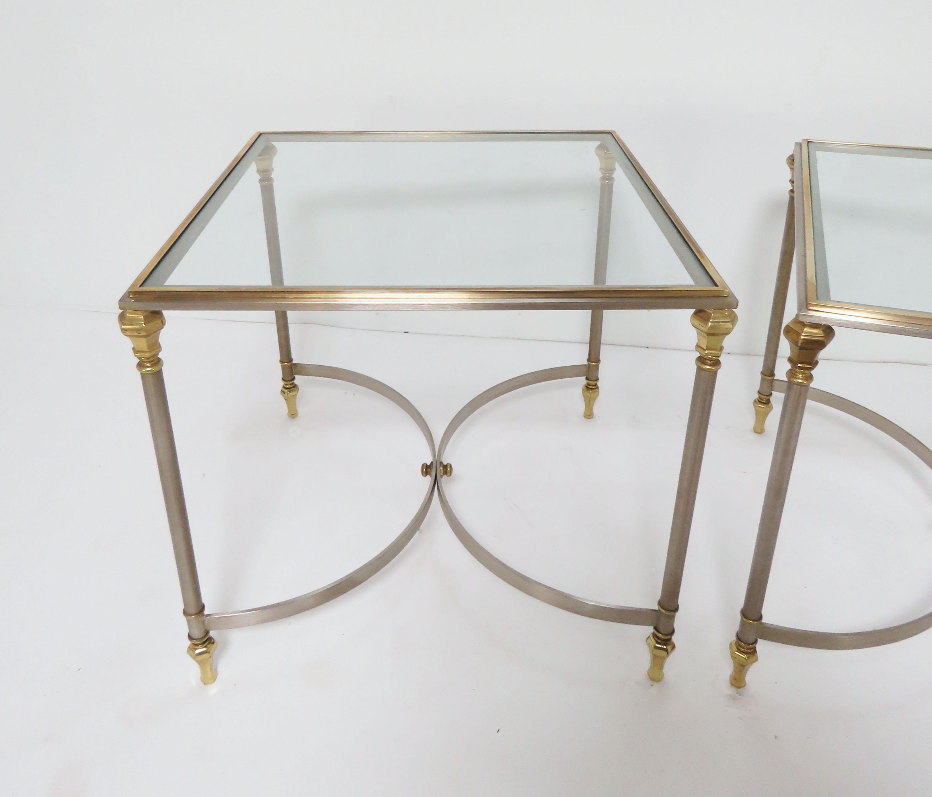 Pair of mixed metal (brushed steel and brass) side tables in the manner of Maison Jansen, made in Italy and imported to the United States by Ethan Allen in the 1960s.