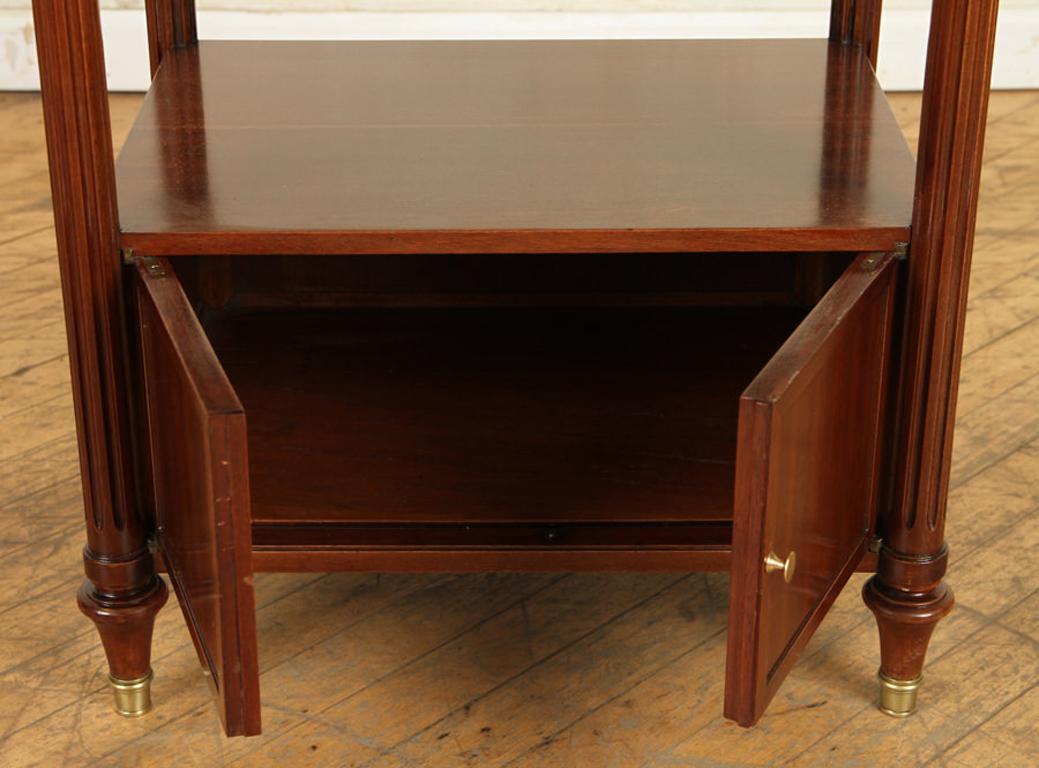 Mid-20th Century Pair of Maison Jansen Two-Tier Mahogany Side Tables with Marble Tops, circa 1940