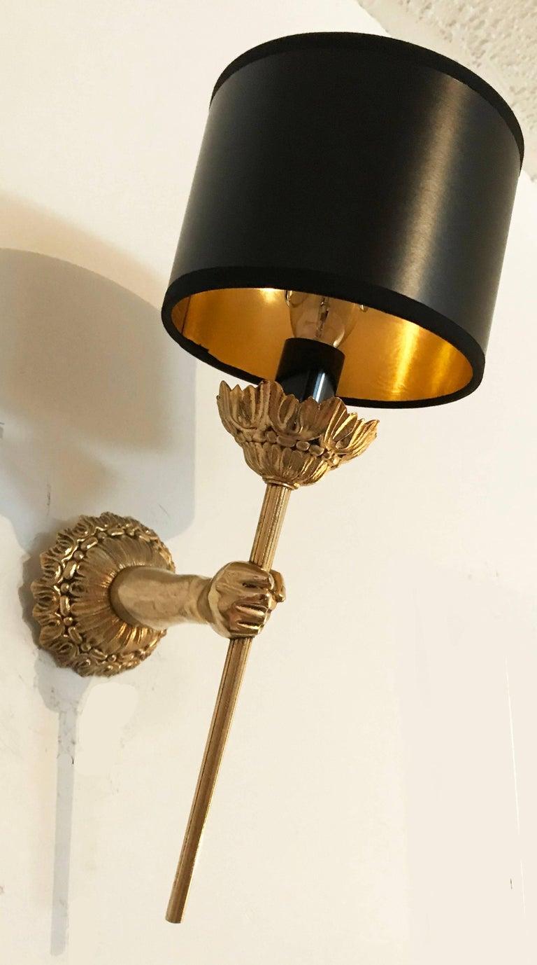 Neoclassical Pair of Maison Lancel Sconces Brass Hand Holding Torch For Sale