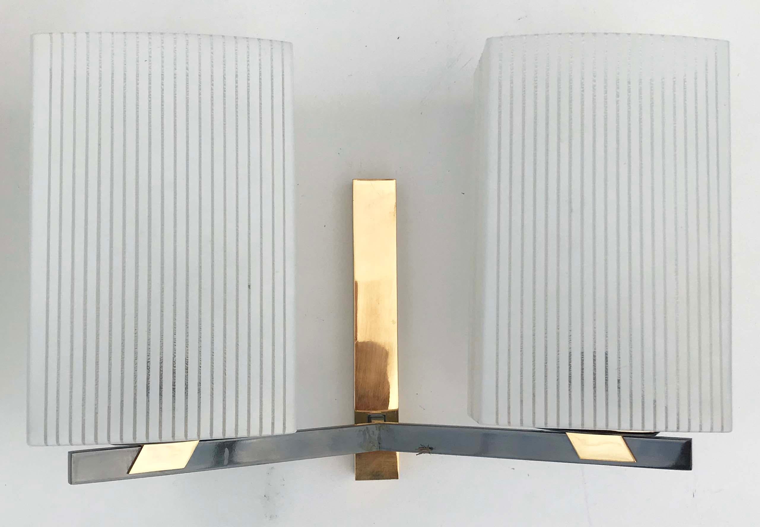 Superb pair of Maison Lancel sconces , 2 patina, gold plating and gun metal.
Very good original finish
Original opalines in perfect condition
2 lights per sconces, 60 watts max bulb
Back plate: 7.7/8