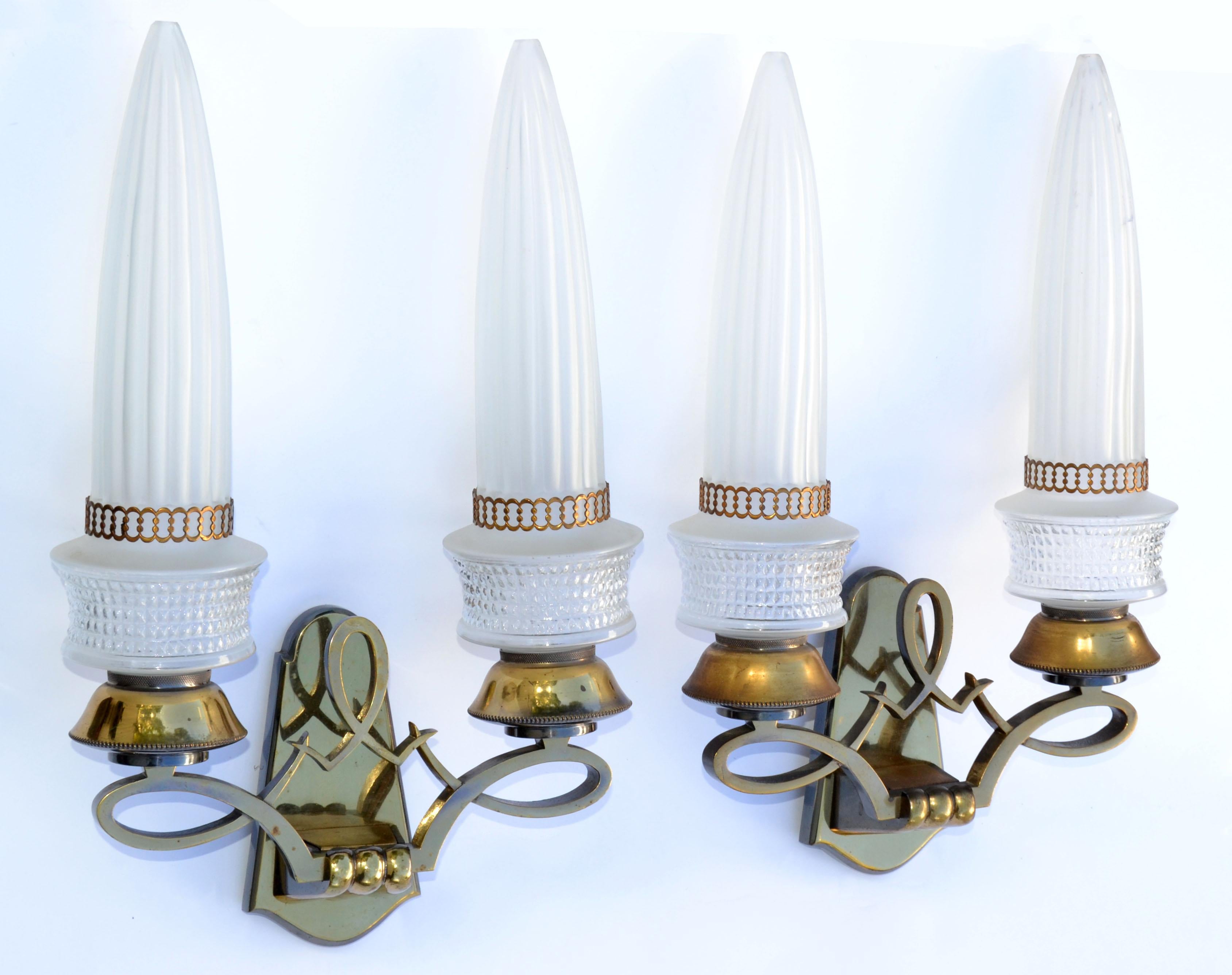 Classic and elegant Art Deco original Maison Liberos Bronze Sconces with the original Glass Shades made in Paris circa 1950s.
Foil Label inside the Back Plate: Creation Liberos Paris.
We have 3 Sconces available, priced by pair.
Working condition