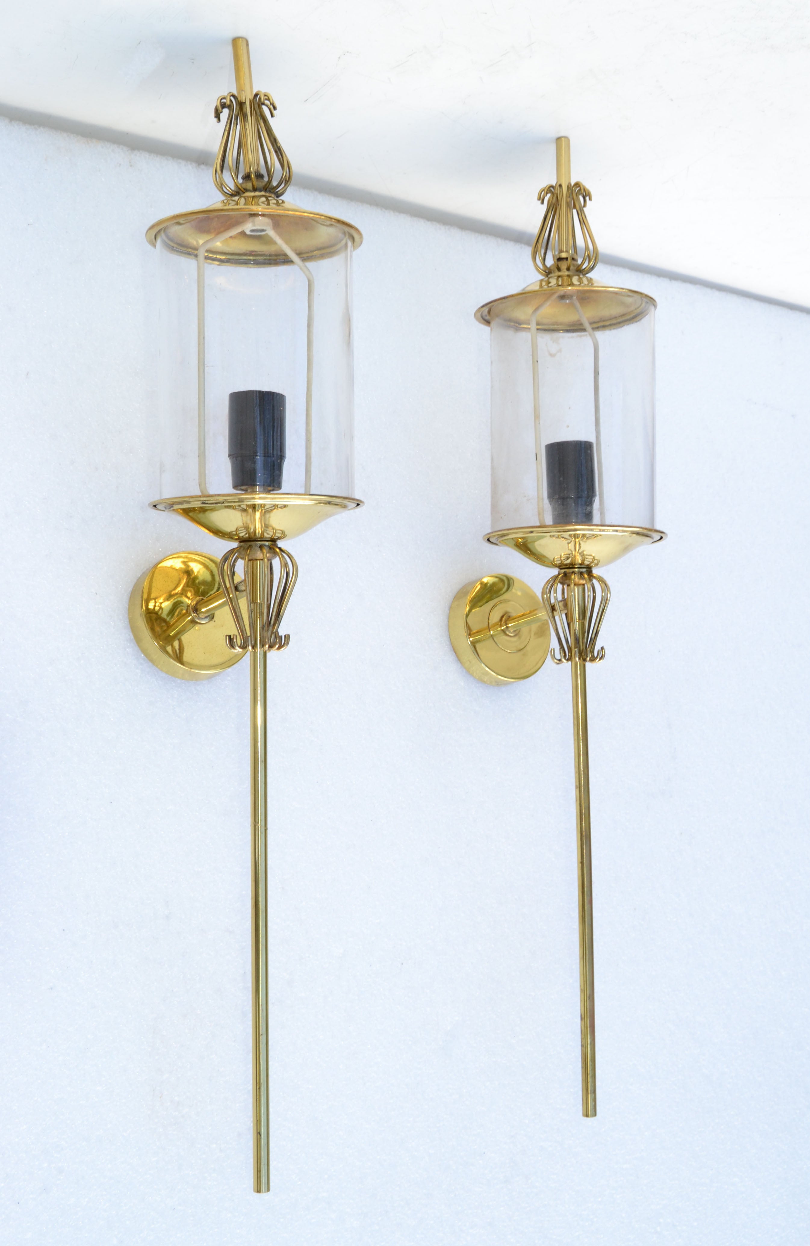 Very unusual and elegant pair of wall lantern sconces by Lunel France Paris. 
Brass Core with 1 light glass Lantern. 
We have three pair sconces available. Priced by Pair. 
US wired and in working condition. Each Sconce takes 1 candelabra light