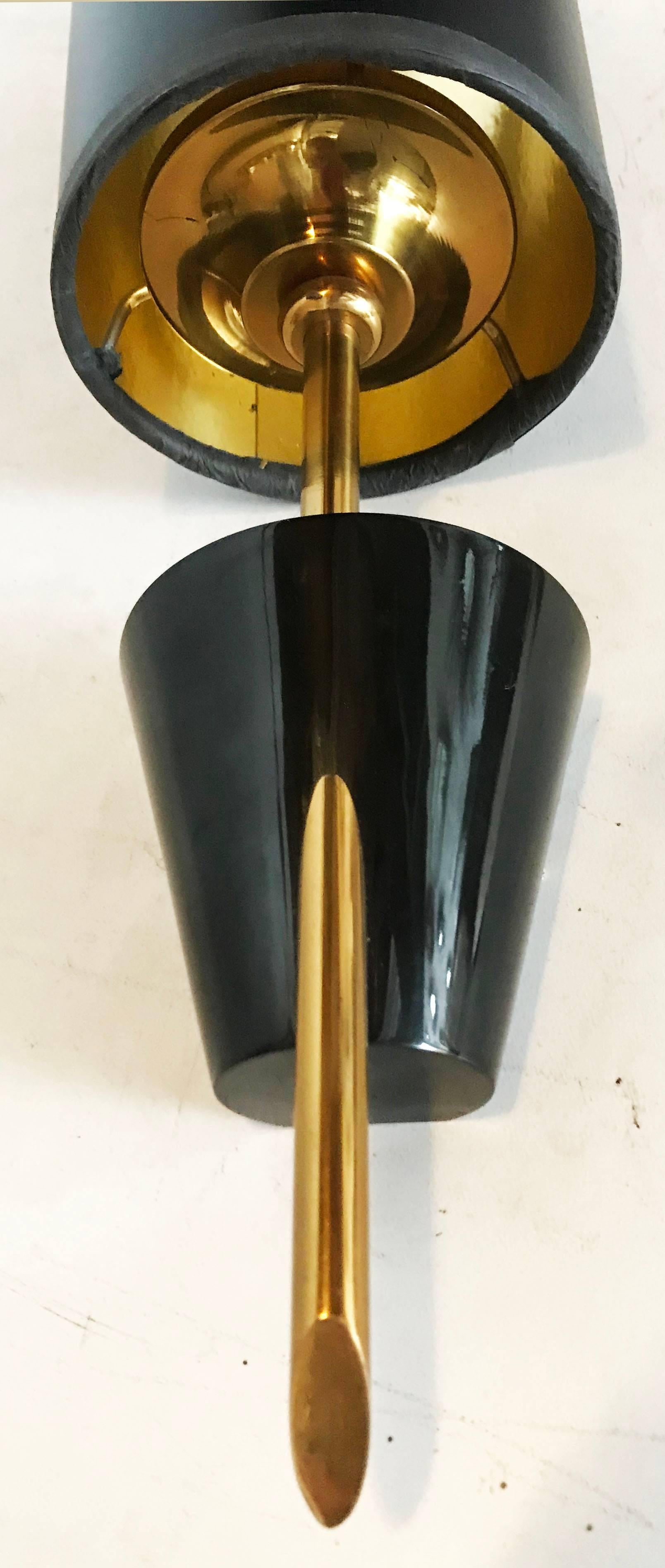 Pair of French sconces by Maison Lunel in Brass & Gunmetal with custom made Gold & Black Paper Shades.
Wired for US and in working condition, each takes one light bulb 40 watts max.
Cylinder Shade measures: Diameter: 4 inches, Height: 7.5 inches.