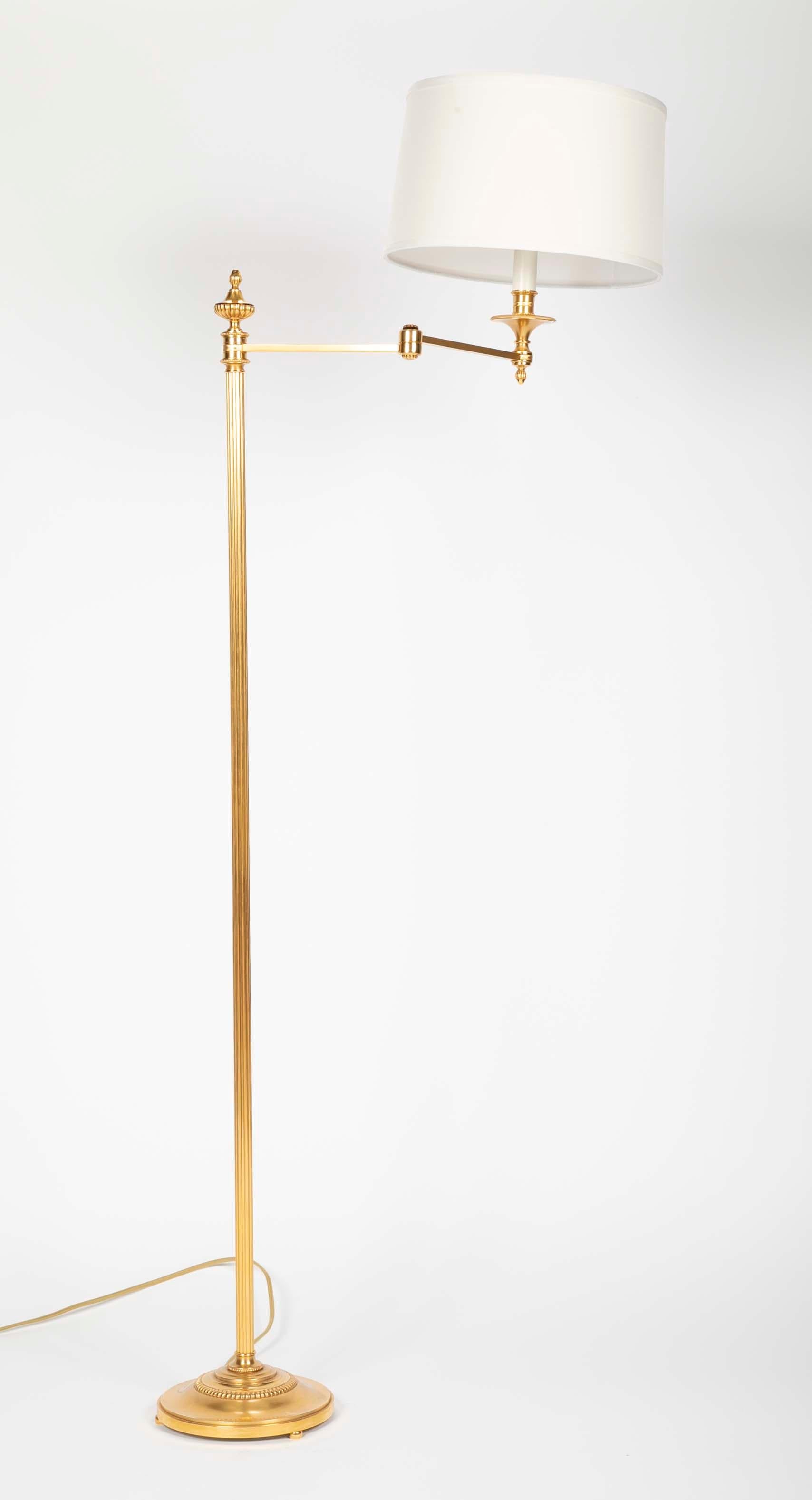 A pair of gilt bronze, swing-arm floor lamps by Maison Meilleur, France. Two pairs available.