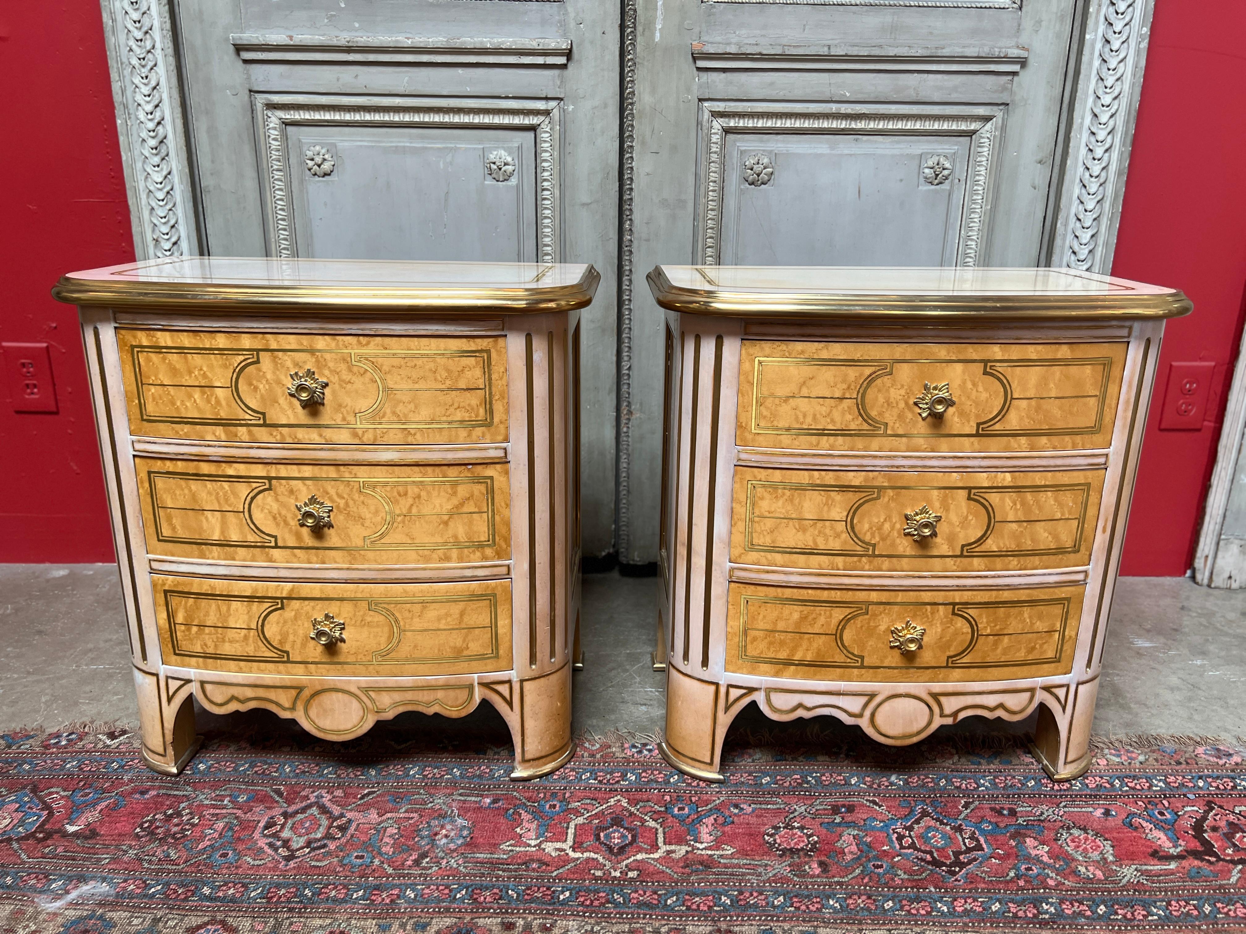 A pair of Maison Romeo small chest of drawers from the 1980s with brass inlay bronze dore pulls and pink-blush lacquer.  
These very decorative chest are small and could be used as bedside chest or next to a sofa.  