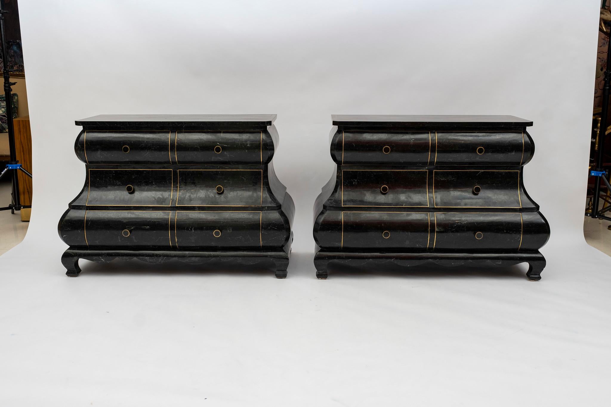 A vintage pair of Maitland Smith tessellated black stone Bombay chests featuring three drawers and brass inlay detailing.
  