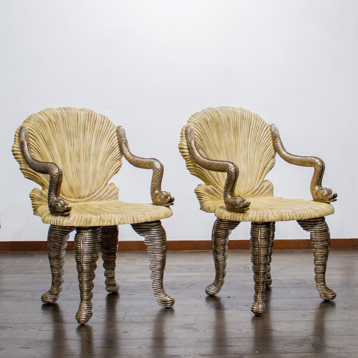 Pair of Venetian style, silvered Grotto armchairs with a clam shell back and seat with neoclassical dolphin armrests and shell shaped cabriole legs, the undersides with a printed label ‘made in the Philippines, designed by Maitland Smith’ circa