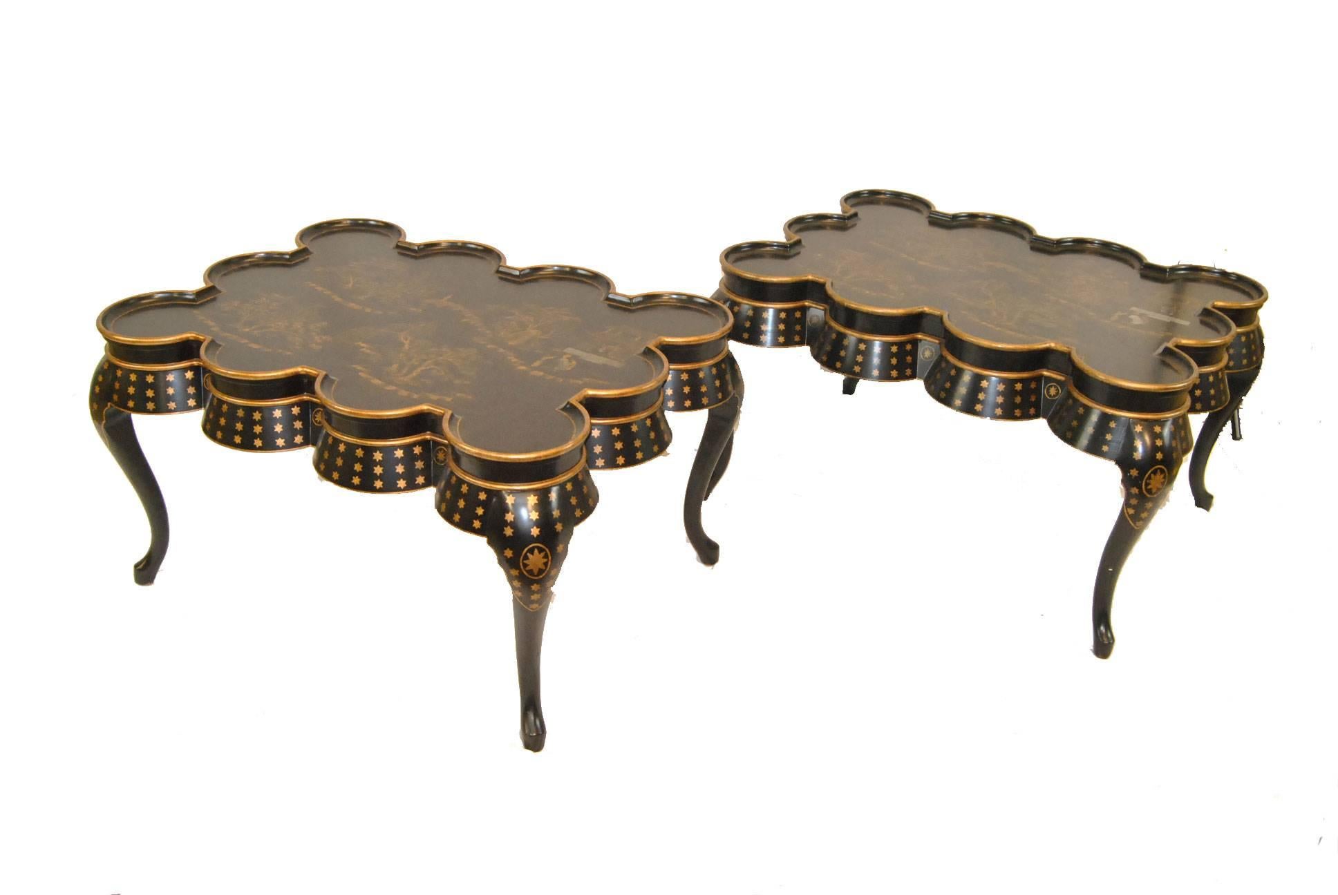 A stunning pair of chinoiserie table by Maitland Smith. Beautifully hand painted gold gilt on black. They feature a scalloped edge atop cabriole legs. Sure to enhance amy decor. Very good condition with minor crazing to the tops. Dimensions: 29