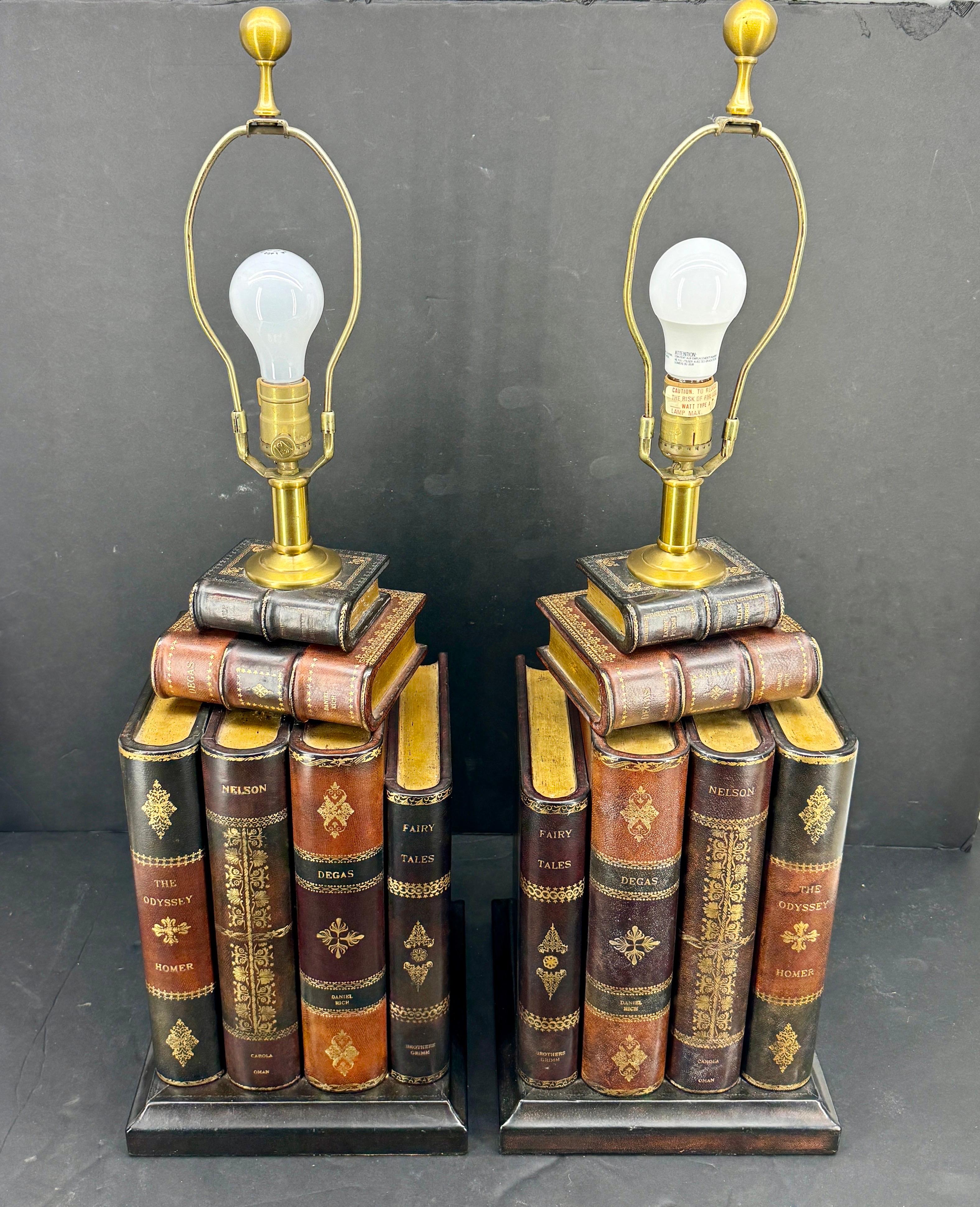 These charming tall lamps feature wooden faux books in a realistic form with each book showing texture and great patina. Each leather book has been painted in warm tones with gold embossed details. This set includes the stately lamp shades as shown.