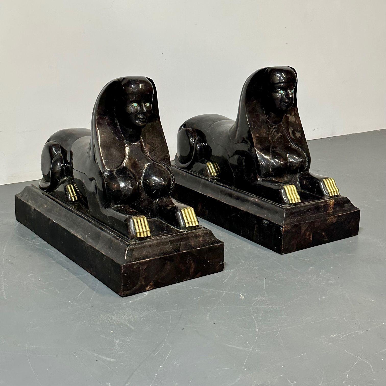 Pair of Maitland Smith Tessellated Egyptian Seated Sphinxes, Entryway

A pair of large and impressive tessellated seated sphinxes. If lighting up your entrance way is what your looking to do this pair of seemingly flawless seated deities are