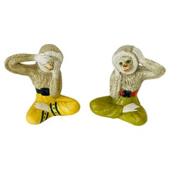 Coppia di sculture di scimmie in maiolica