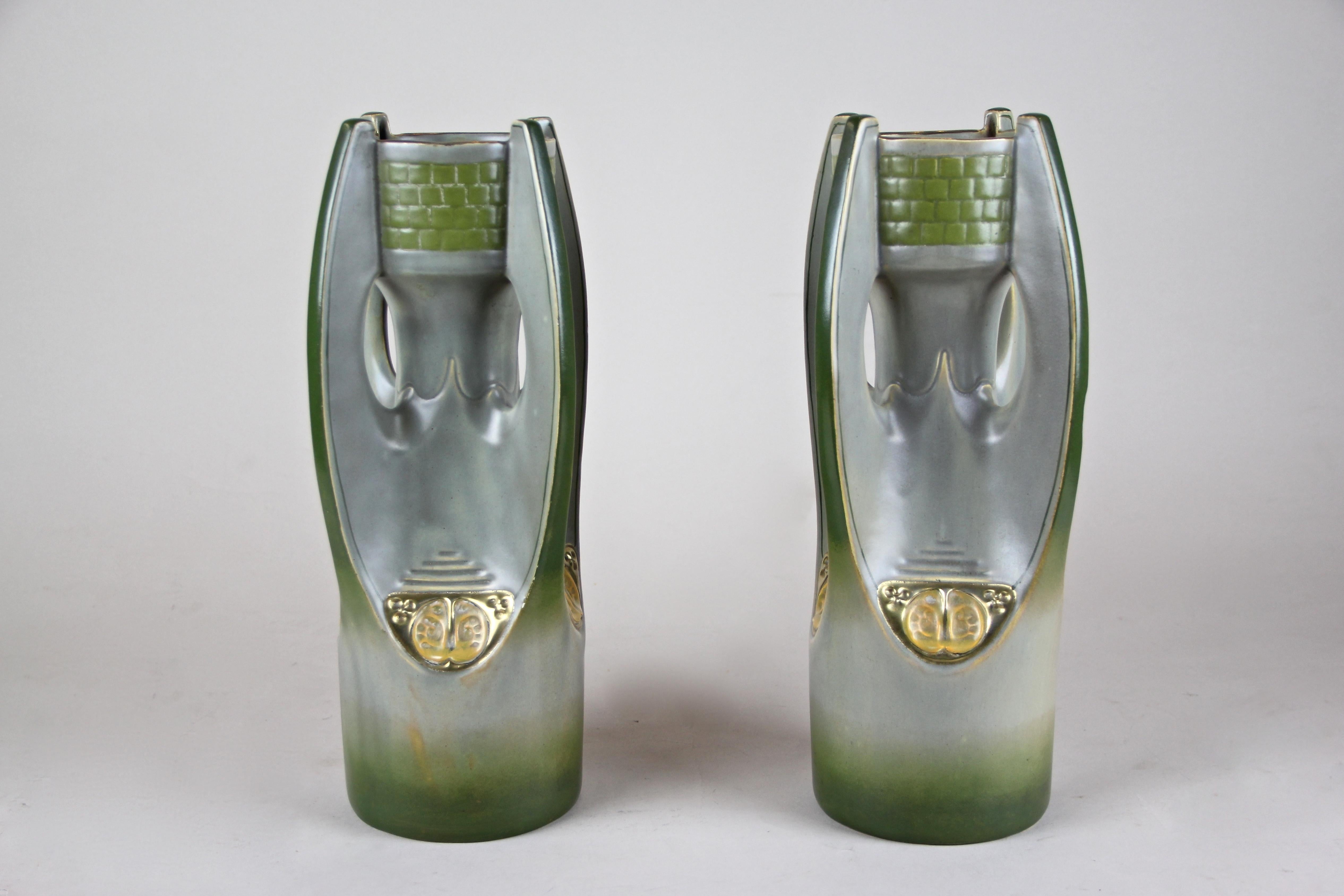 This exceptional pair of Majolica vases are absolute rare pieces of the early Art Nouveau period. Manufactured in Biela/Bohemia - now the Czech Republic - by the renown company of Julius Dressler around 1900, these large vases come in very good