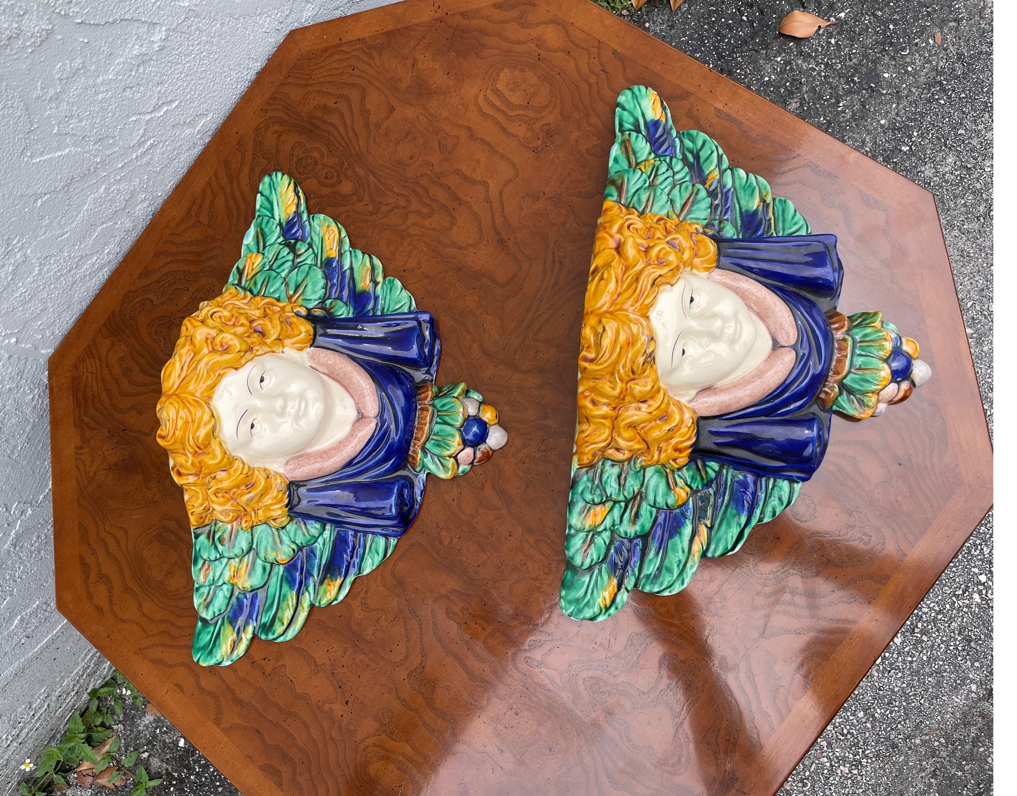 Pair of decorative Angel Majolica wall brackets.