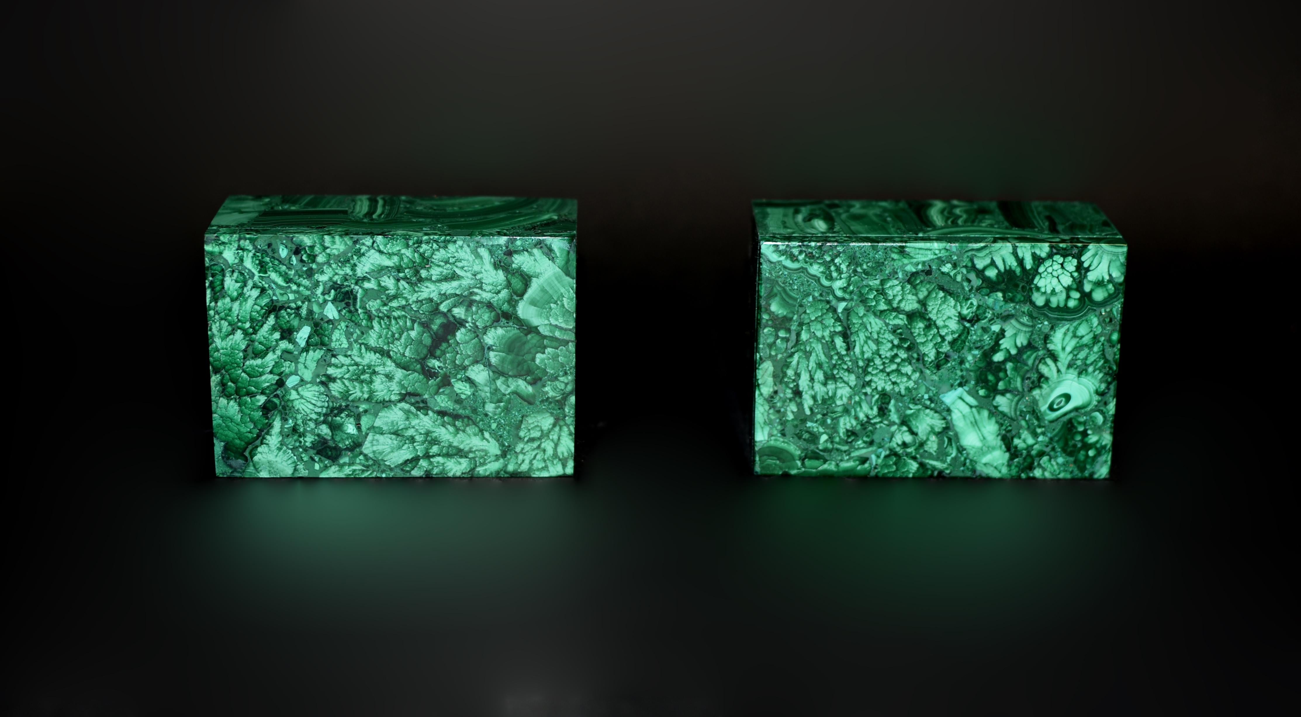 A captivating pair of grade AAA malachite boxes, crafted from the finest natural malachite. These exceptional pieces showcase the stunning diversity of malachite patterns, including intricate turkey tails, striking bullseyes, delicate moss,