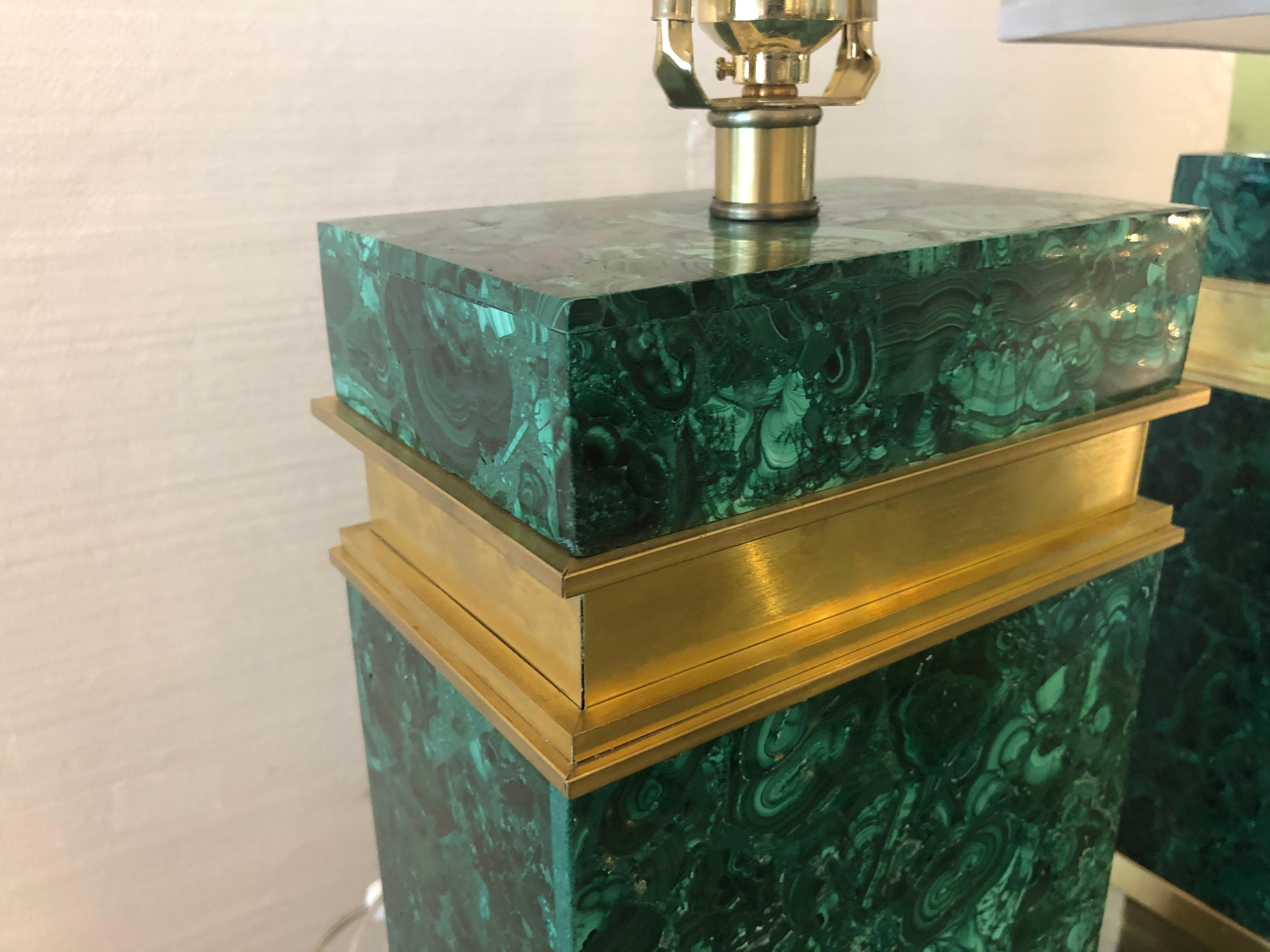 a pair of modernist gilt bronze mounted malachite veneered table lamps.
