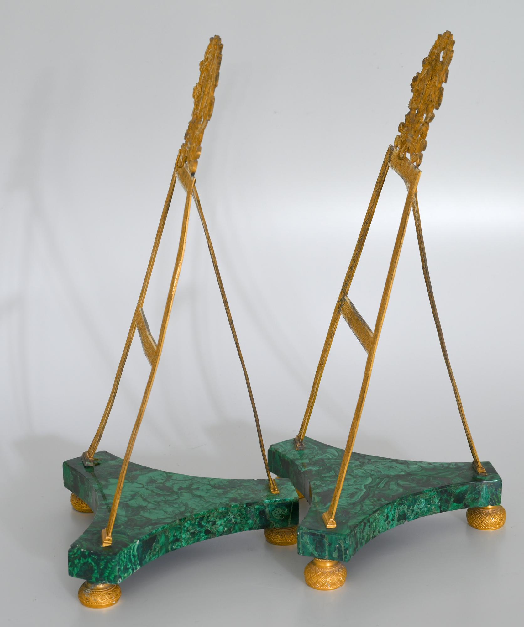 Pair of malachite stands, St.Petersburg early 19th century, fire gilded bronze 

Fire gilded bronze with an malachite base. The stands were made to suspend miniatures or the like. They are Russian luxury goods, which were made for the European