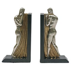 Paire de serre-livres à figures masculines