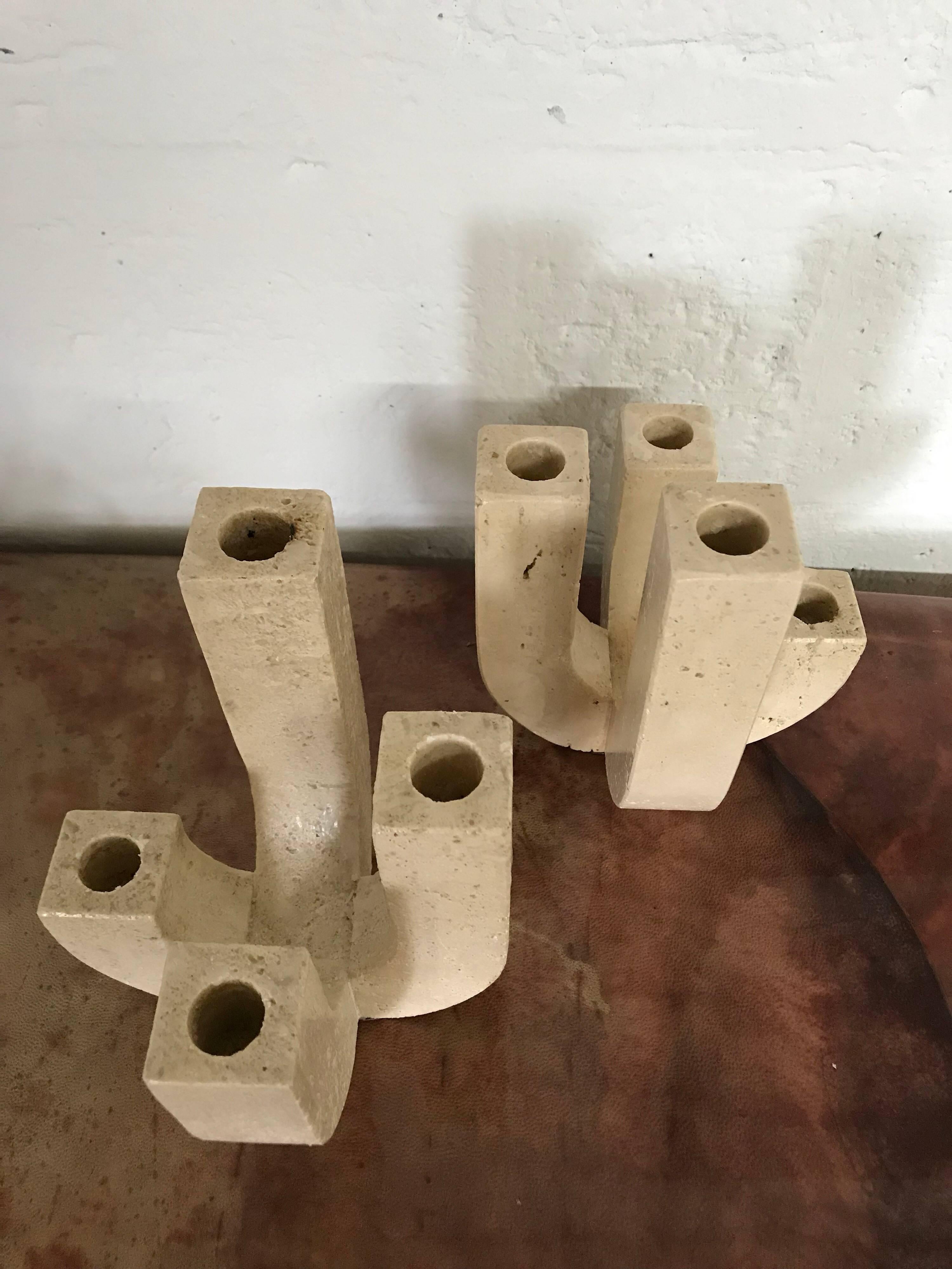 Postmodern sculptural candelabras or candlestick holders rendered in Travertine for Raymor, Italy, 1980s.