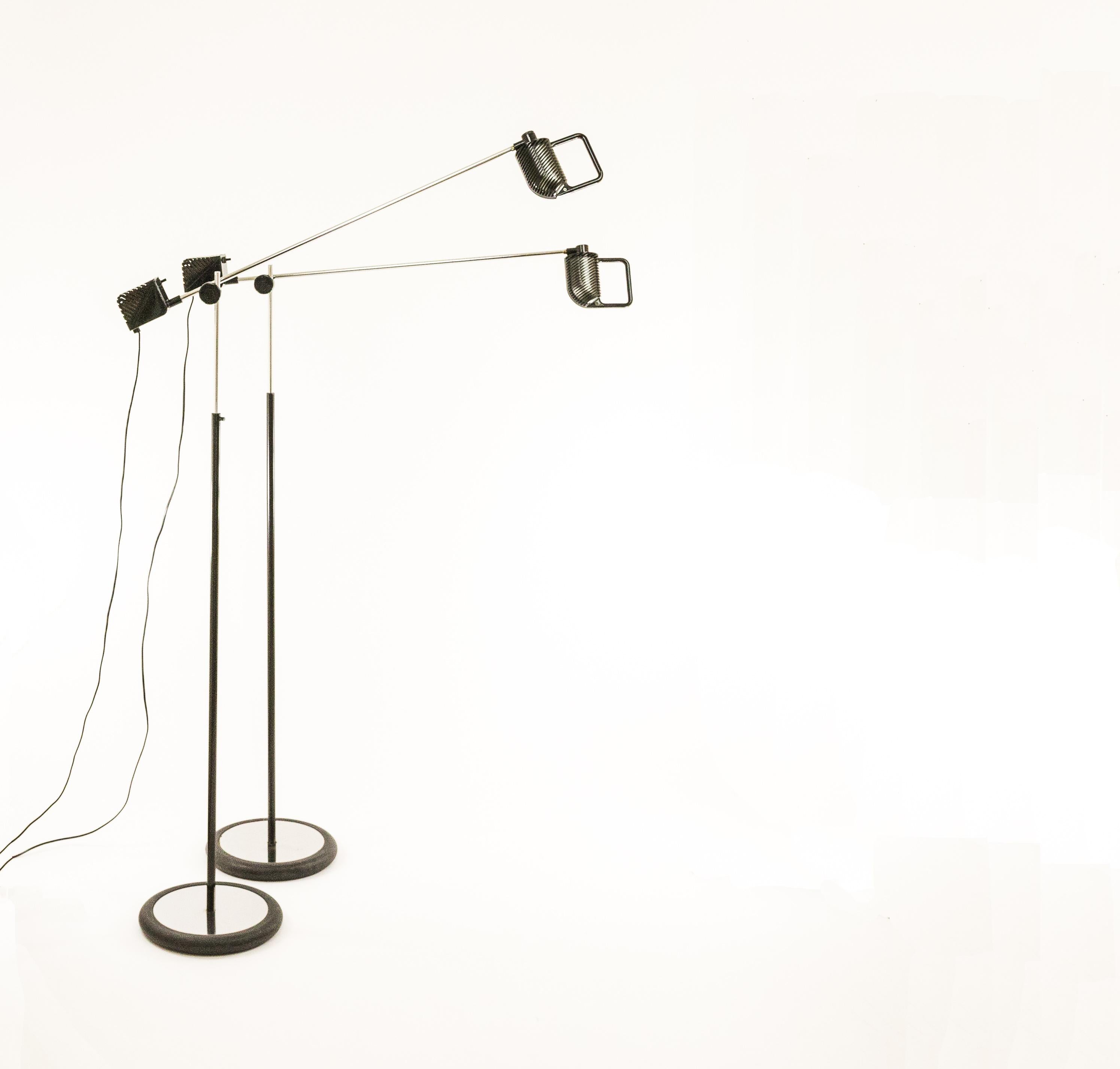 Pair of Maniglia floor lamps designed by Jonathan de Pas, Donato D'Urbino and Paolo Lomazzi for Italian lighting manufacturer Stilnovo.

We found the following description in a Stilnovo advertisement from 1975 -translated from Italian-: 
