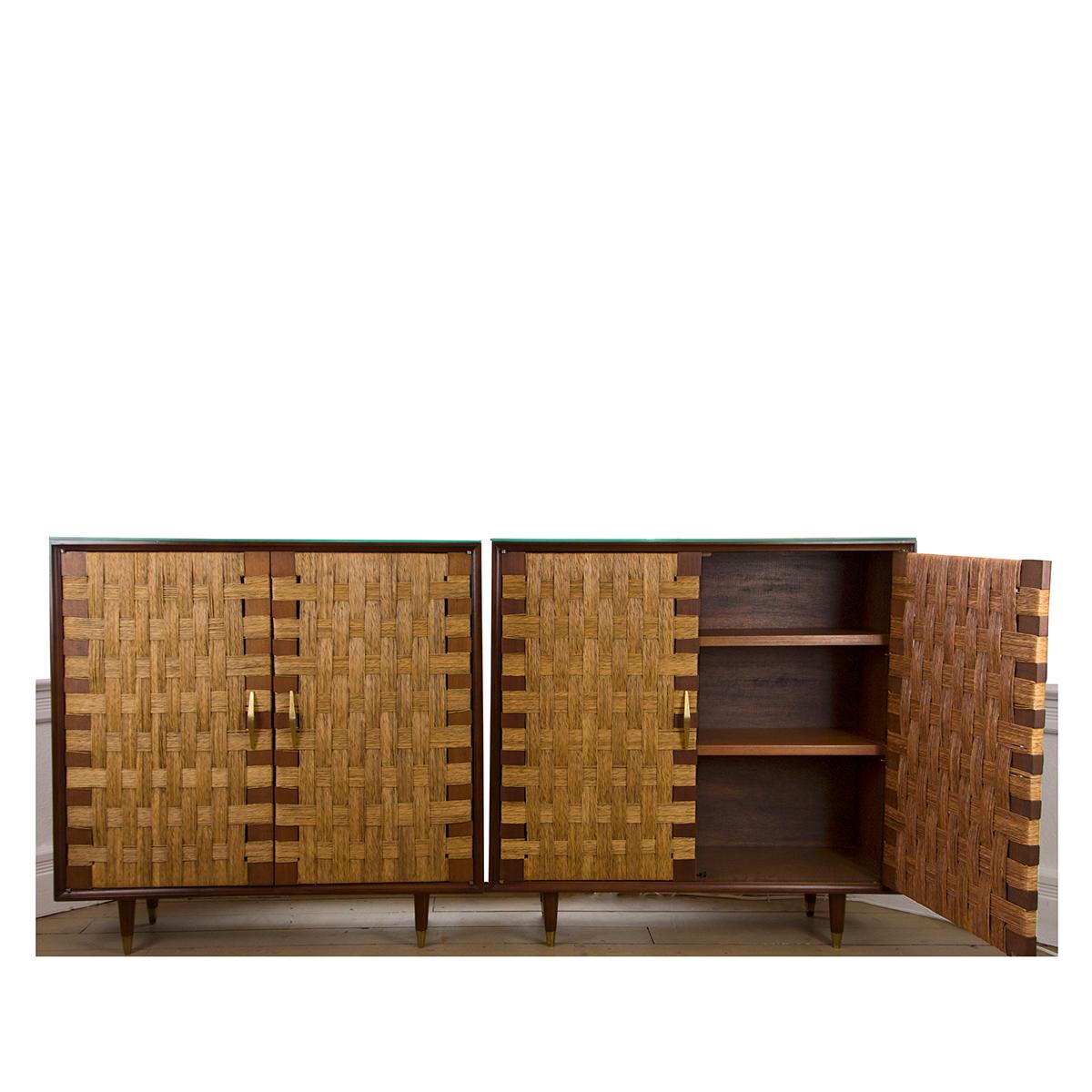 Pair of maple and woven cane cabinets with interior shelves and brass details and
glass tops, by Edmund Spence.