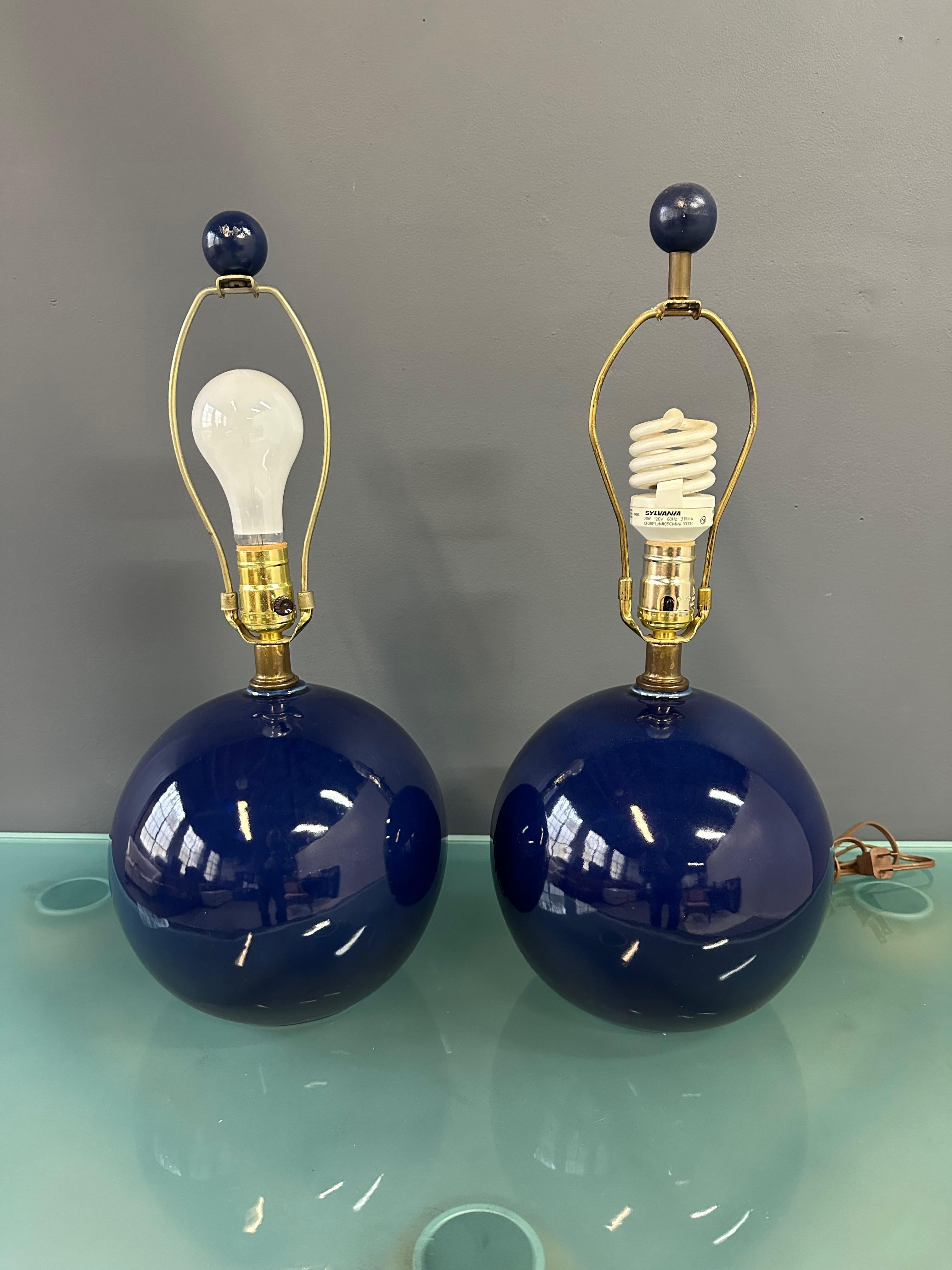Illuminate your space with the sleek and stylish Pair of Mar-Kel Lighting Spherical Blue Glazed Ceramic Lamps. Featuring a mid-century design and a vibrant blue glaze, these lamps will add a touch of sophistication to any room. Crafted with