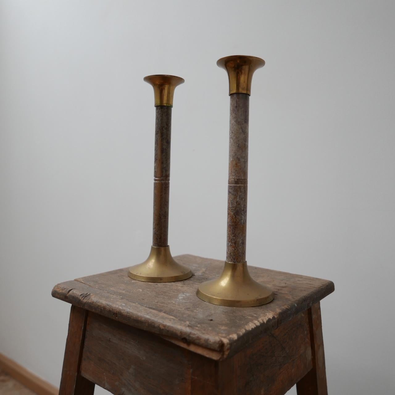 A pair of elegant marble and brass candlesticks.

Midcentury, from Holland.

Simple, functional and timeless.

Dimensions: 30 height x 10 diameter in cm.
 