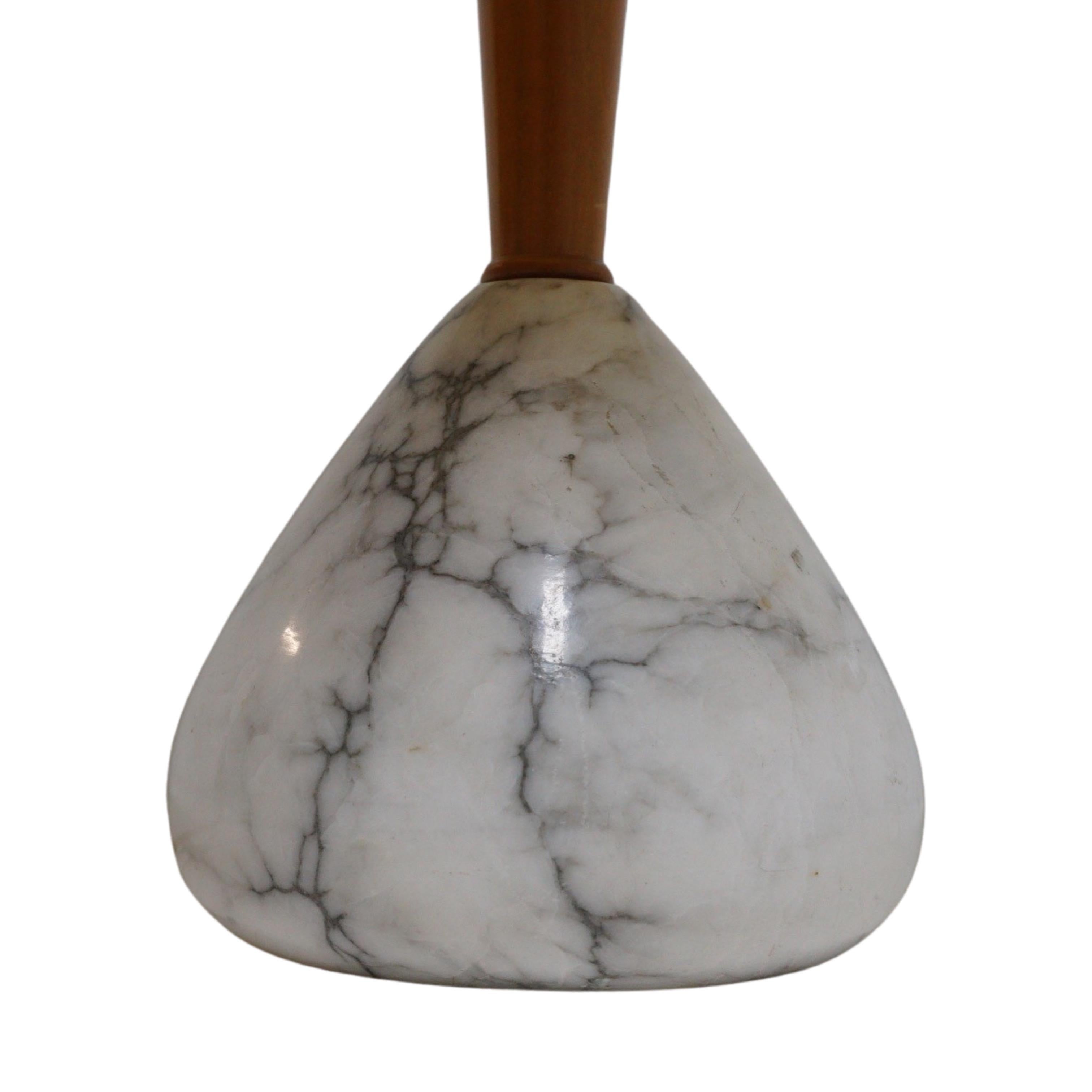 These lamps are like the highway mile markers of the midcentury. Carrara marble wonders – smooth, cool, and leading you on a journey through time. Dust off your vinyl records, put on a Sinatra tune, and let these timeless pieces transport you to an