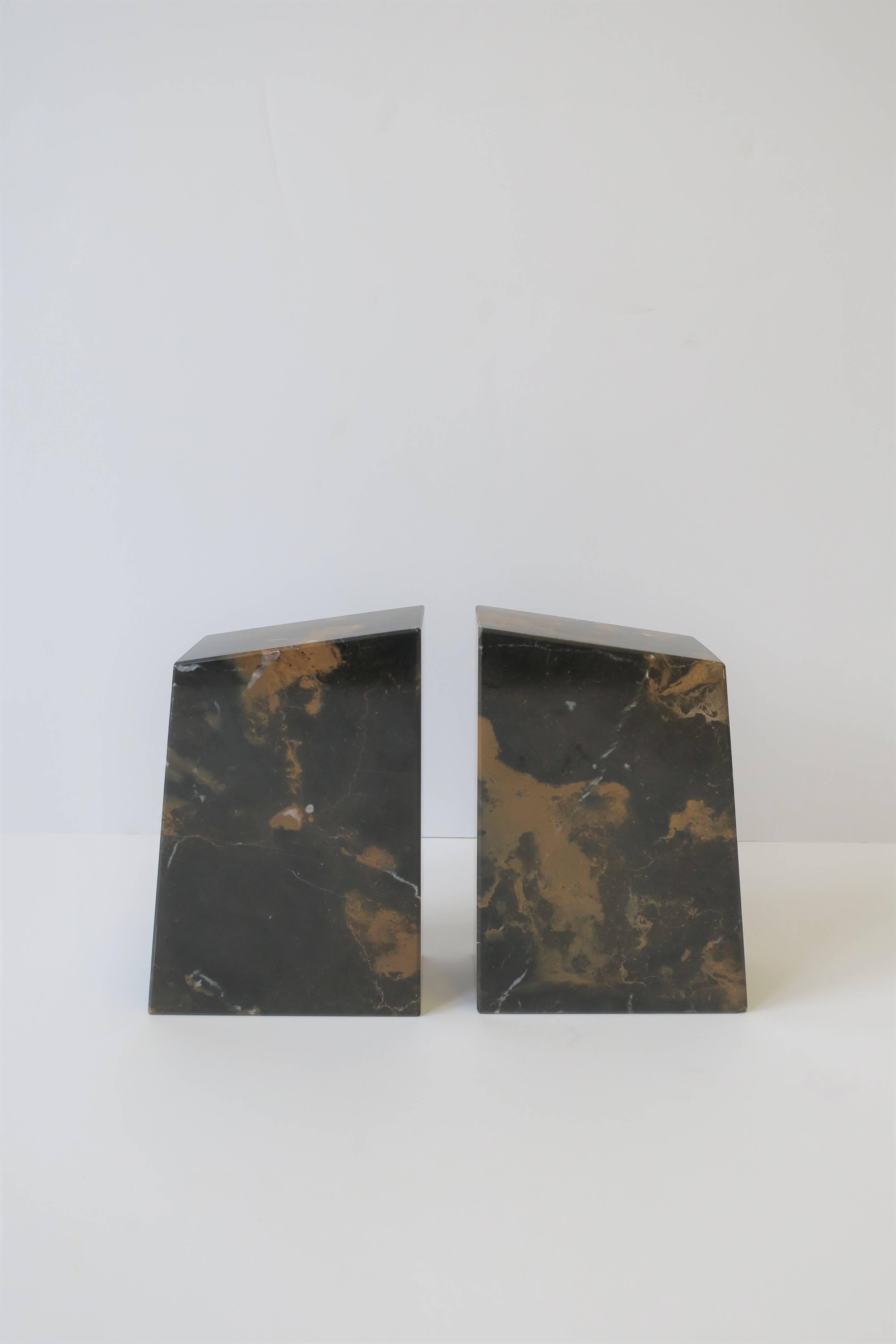 A pair of substantial marble bookends in the Modern style. Colors include dark and light brown with traces of white. Each measure: 2