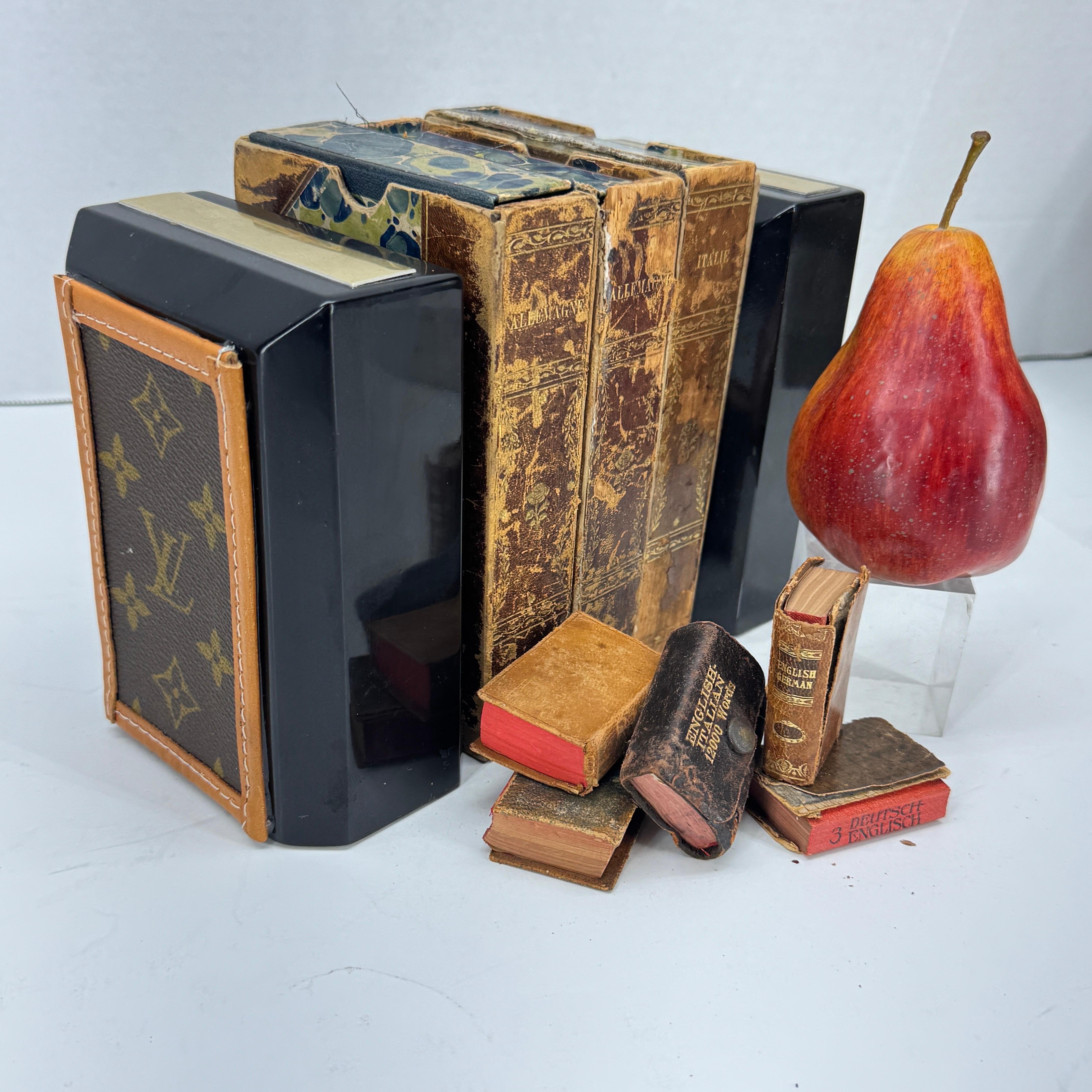 Mid-Century Marble Stone Bookends with Louis Vuitton Monogram Fabric. These custom, substantial monogrammed bookends are custom made with authentic LV fabric. This classic pair are absolutely one of a kind and most certainly would accentuate your