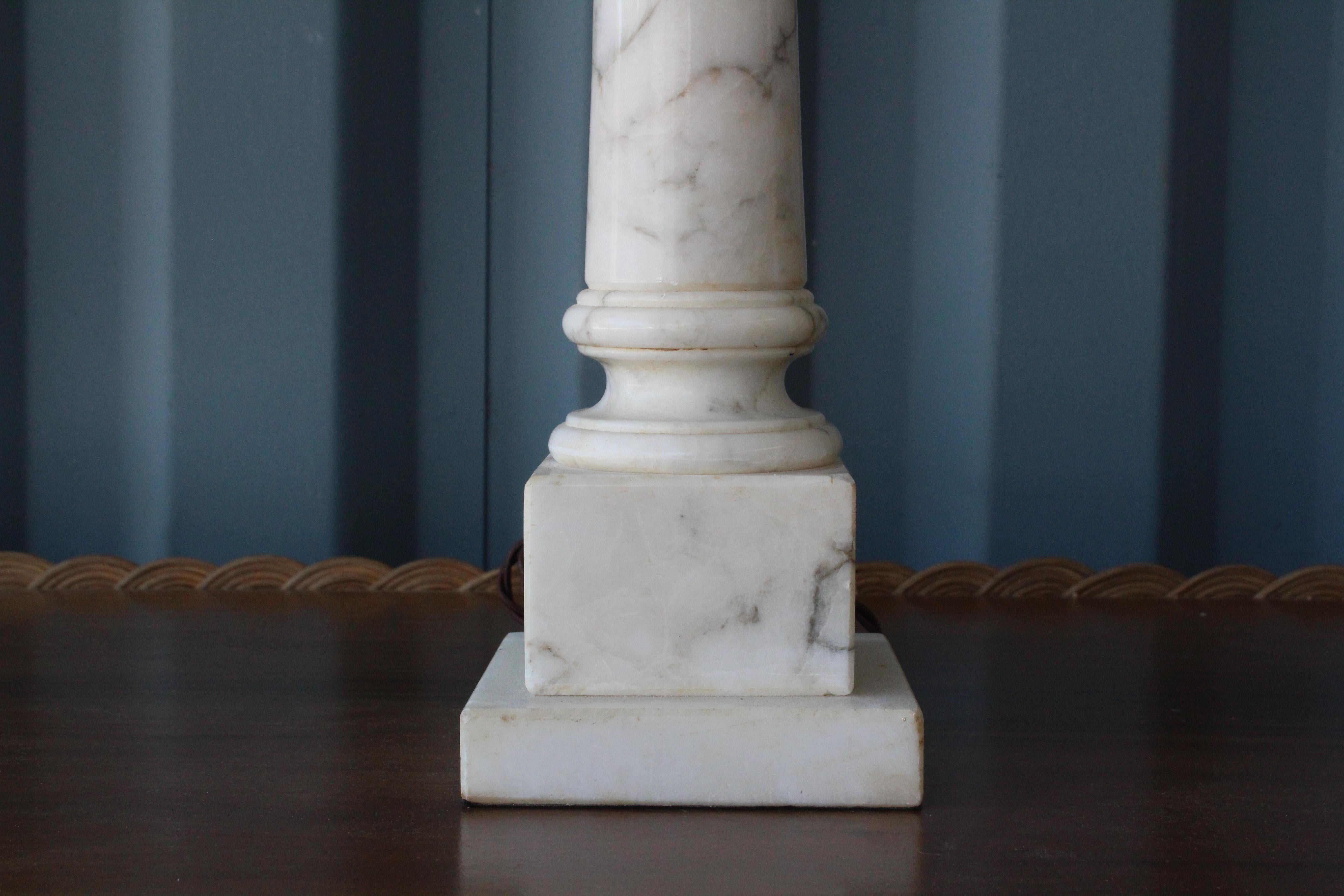 Pair of marble column lamps with new custom made box pleated shades. The pair has been rewired. Sold as a pair.