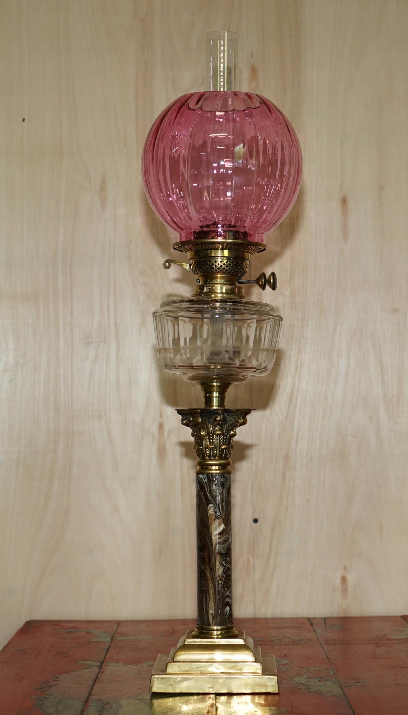 We are delighted to offer for sale this stunning pair of Victorian, Corinthian pillar oil lamps with marbled bases and ruby glass shades

I have a suite of seven Victorian oil lamps, this is the only pair

The lamps have a traditional Italian