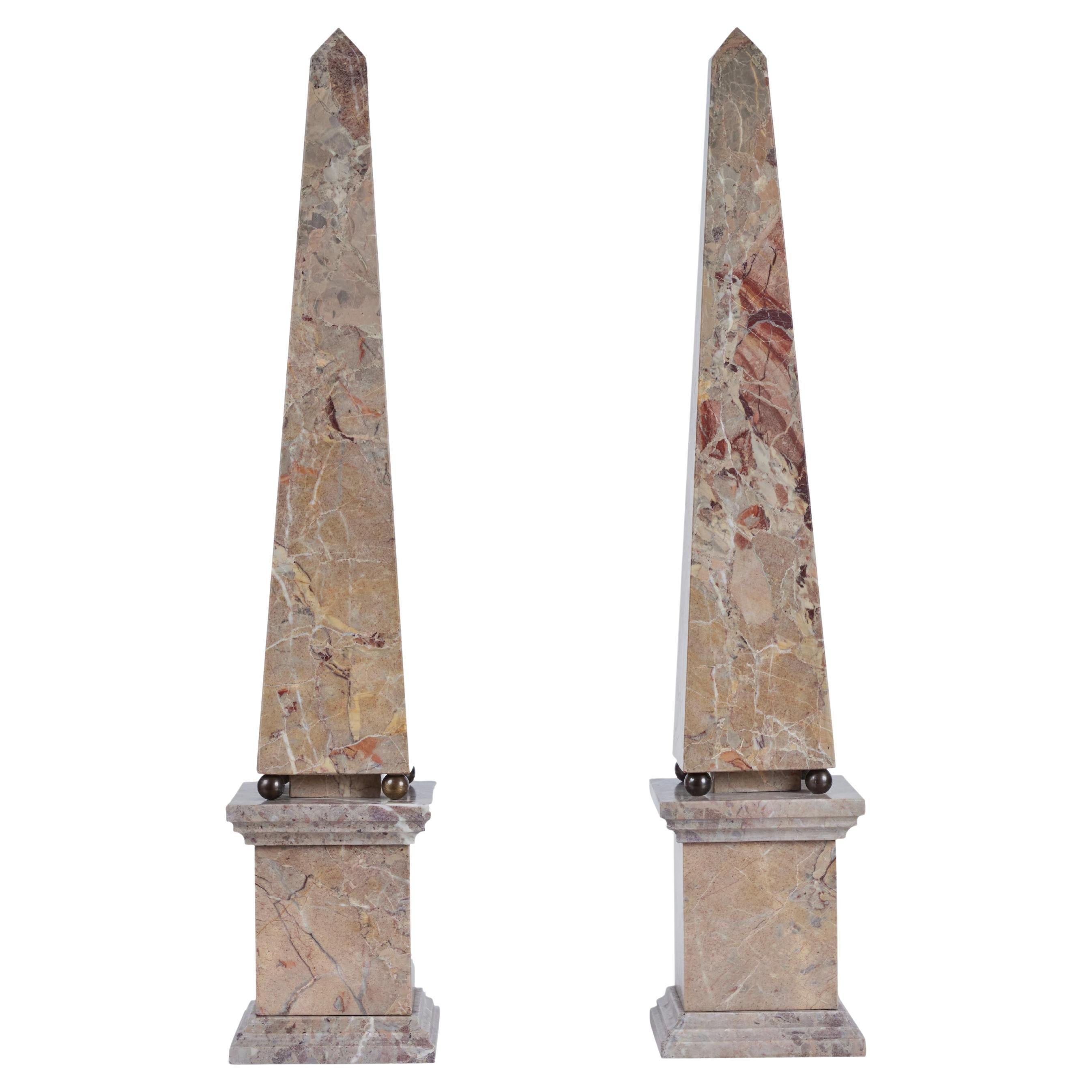 Pair of midcentury, Italian, polished marble obelisks atop four, bronze spheres, and mounted on a stepped plinth.