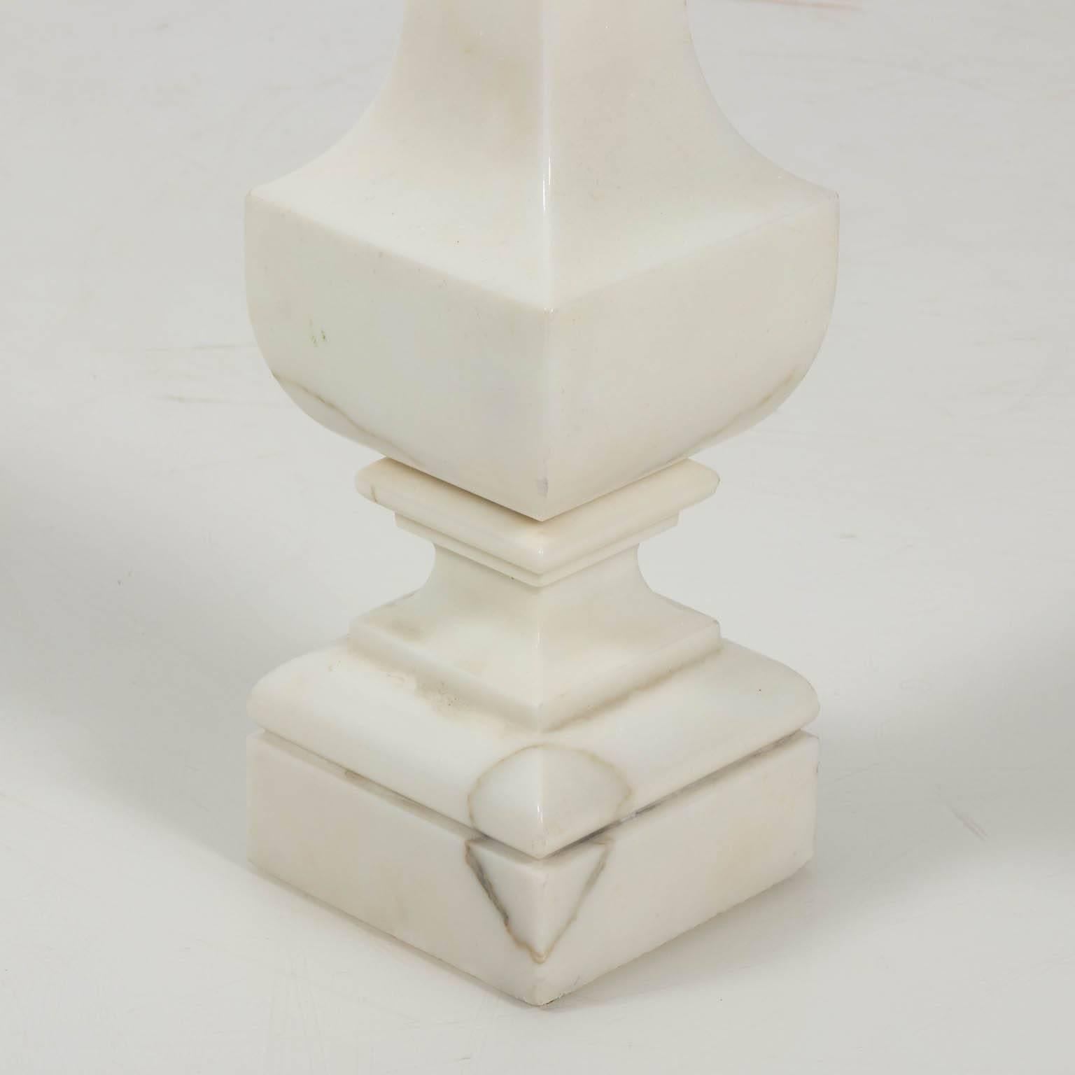Contemporary pair of polished while marble obelisks.
 