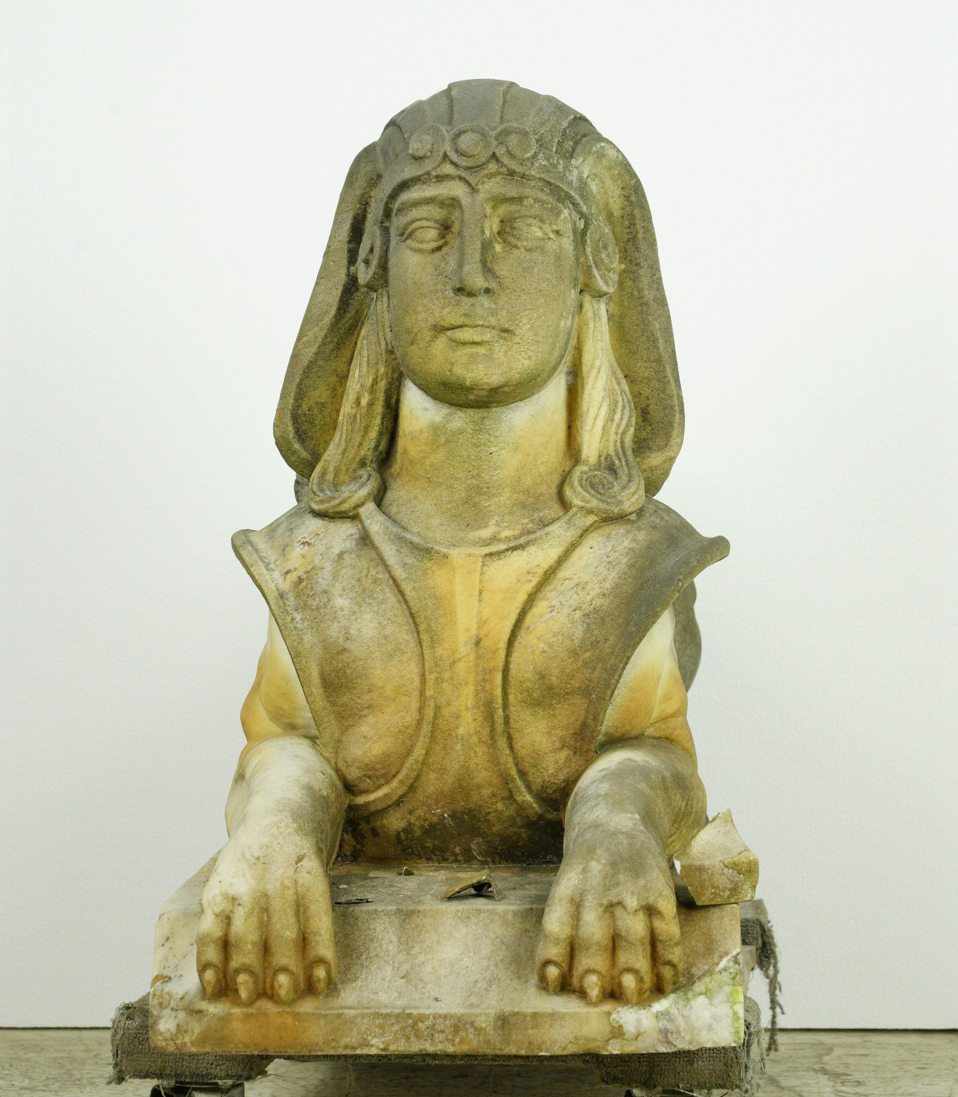This pair from from an estate in Greenwich, Connecticut, adds a touch of classical grandeur to your outdoor space. A sphinx is a mythological creature with a lion's body and a human head, an important image in Egyptian and Greek art and