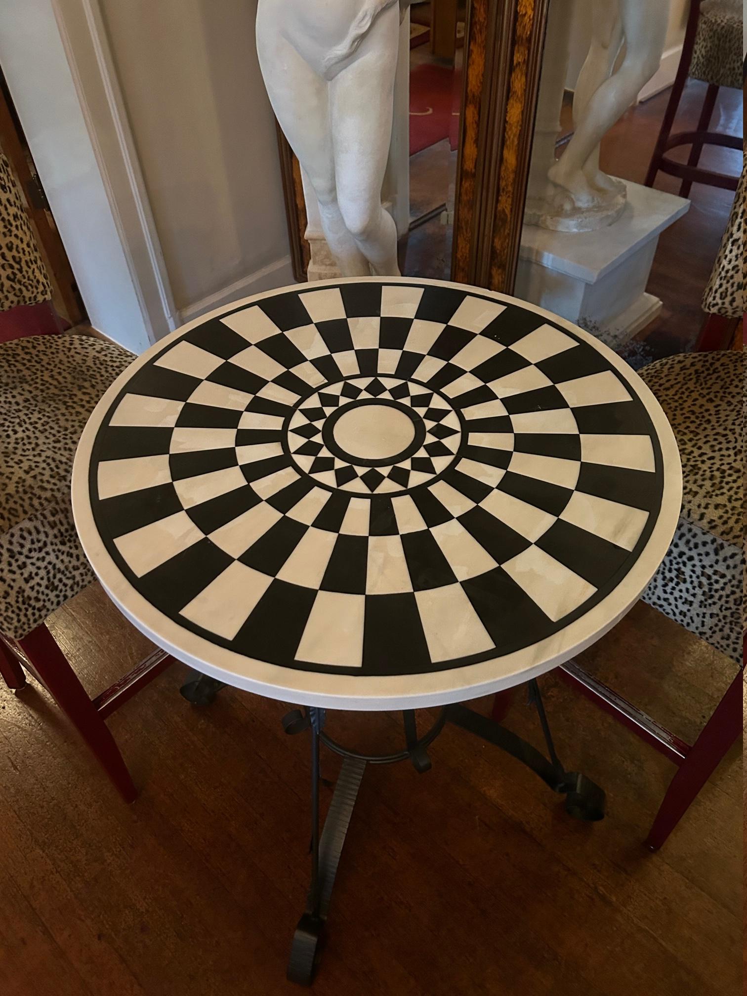 These pair of side tables are unique.
The black and white marble top are in very good condition also the base.

