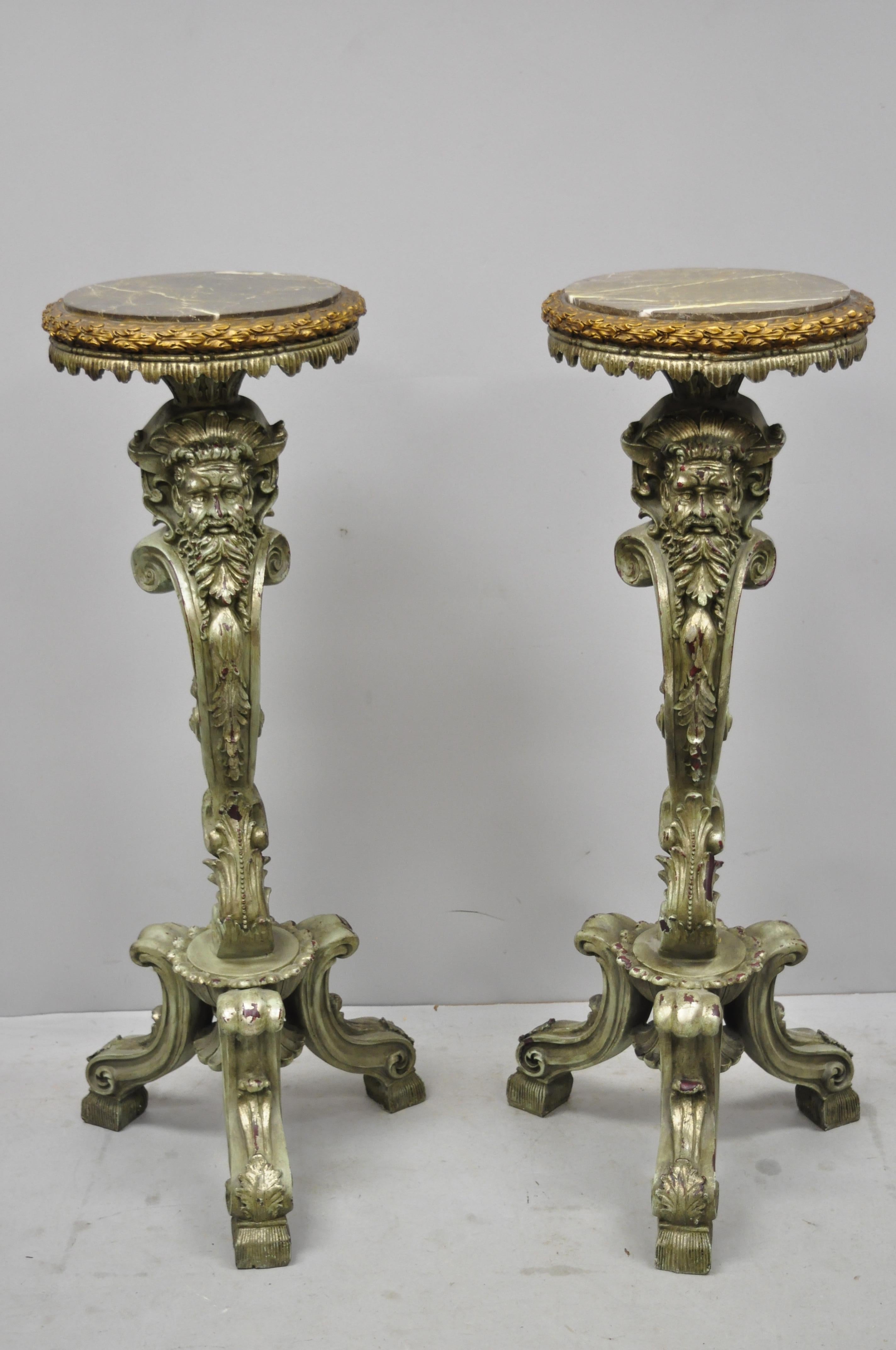 Pair of marble top cast resin figural mythical pedestal stands with bearded faces. Item features round marble tops, cast resin, stately forms with bearded faces, distressed finish, great style and form, circa late 20th century.
Measurements:
44