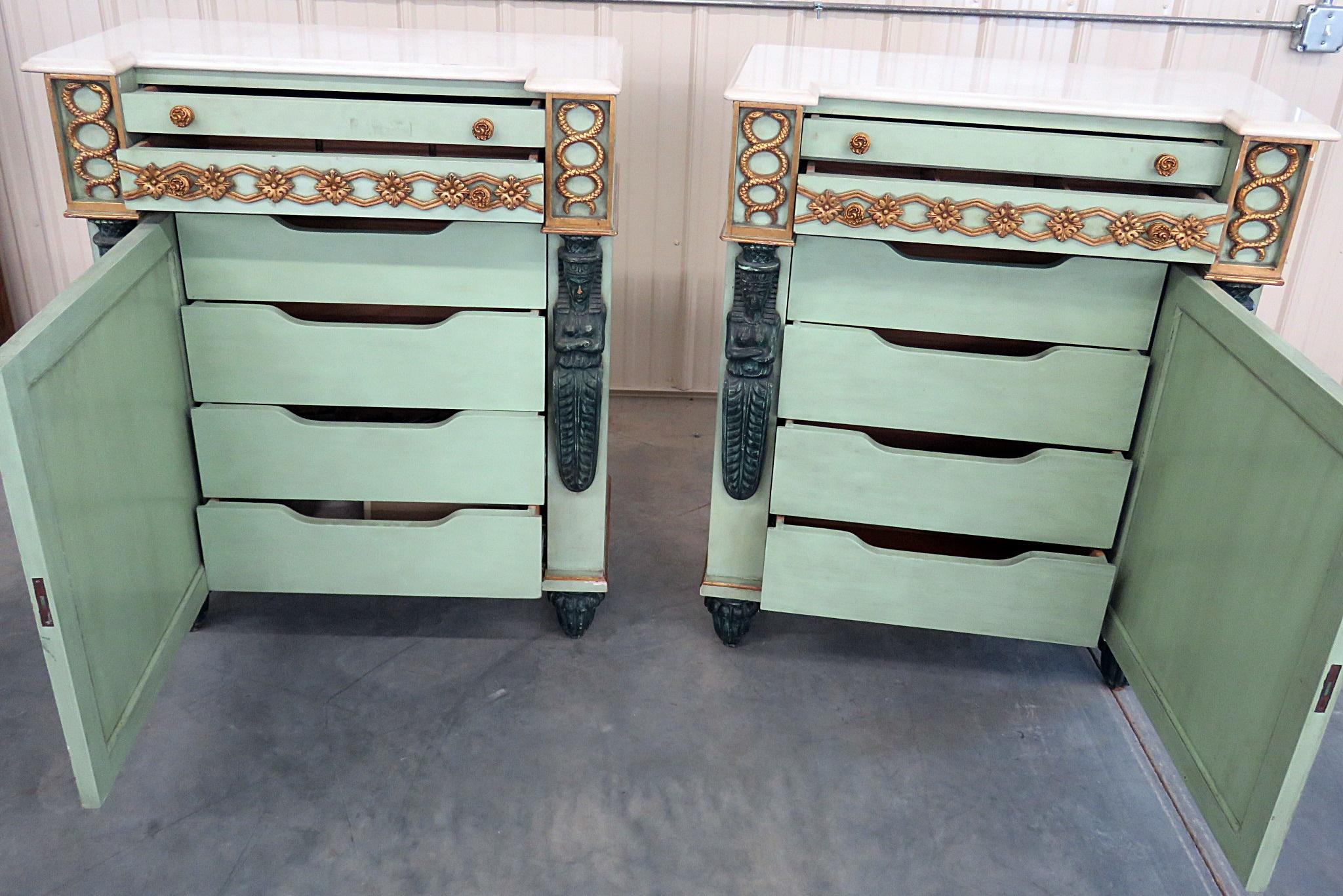 Pair of Empire style distressed painted commodes with 2 doors over 1 door containing 4 drawers.