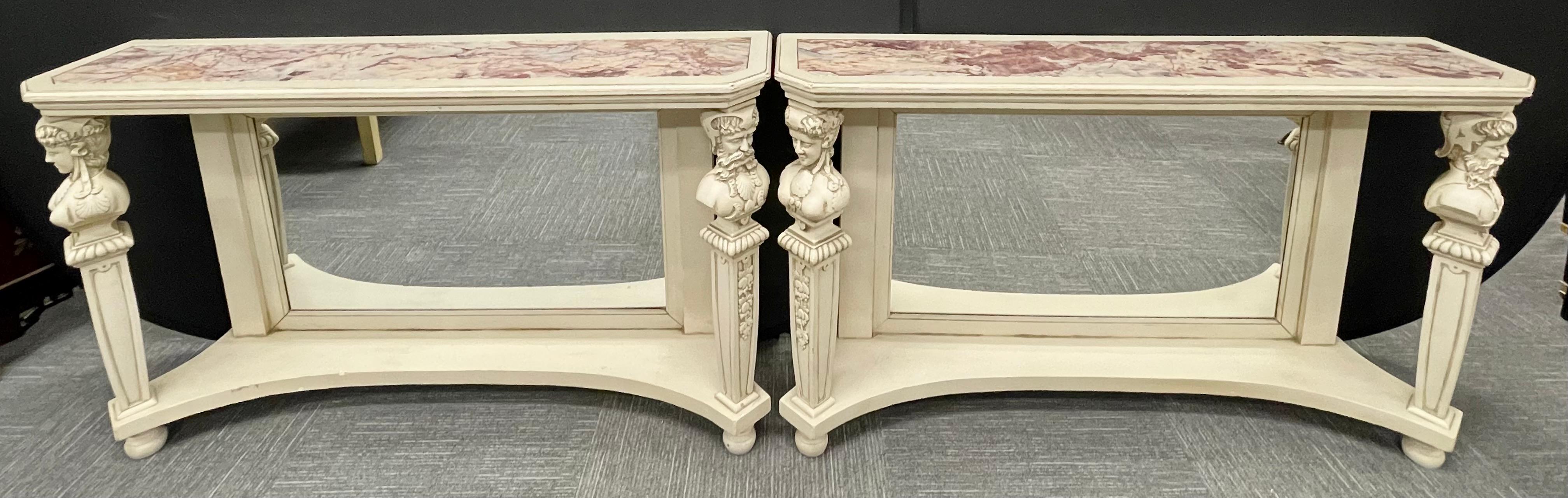 Each distress painted off-white, the oblong marble insert on top, supported on a mirrorred backsplat and two front columns headed on figural motifs, joint with a lower platform, raised on bun feet.