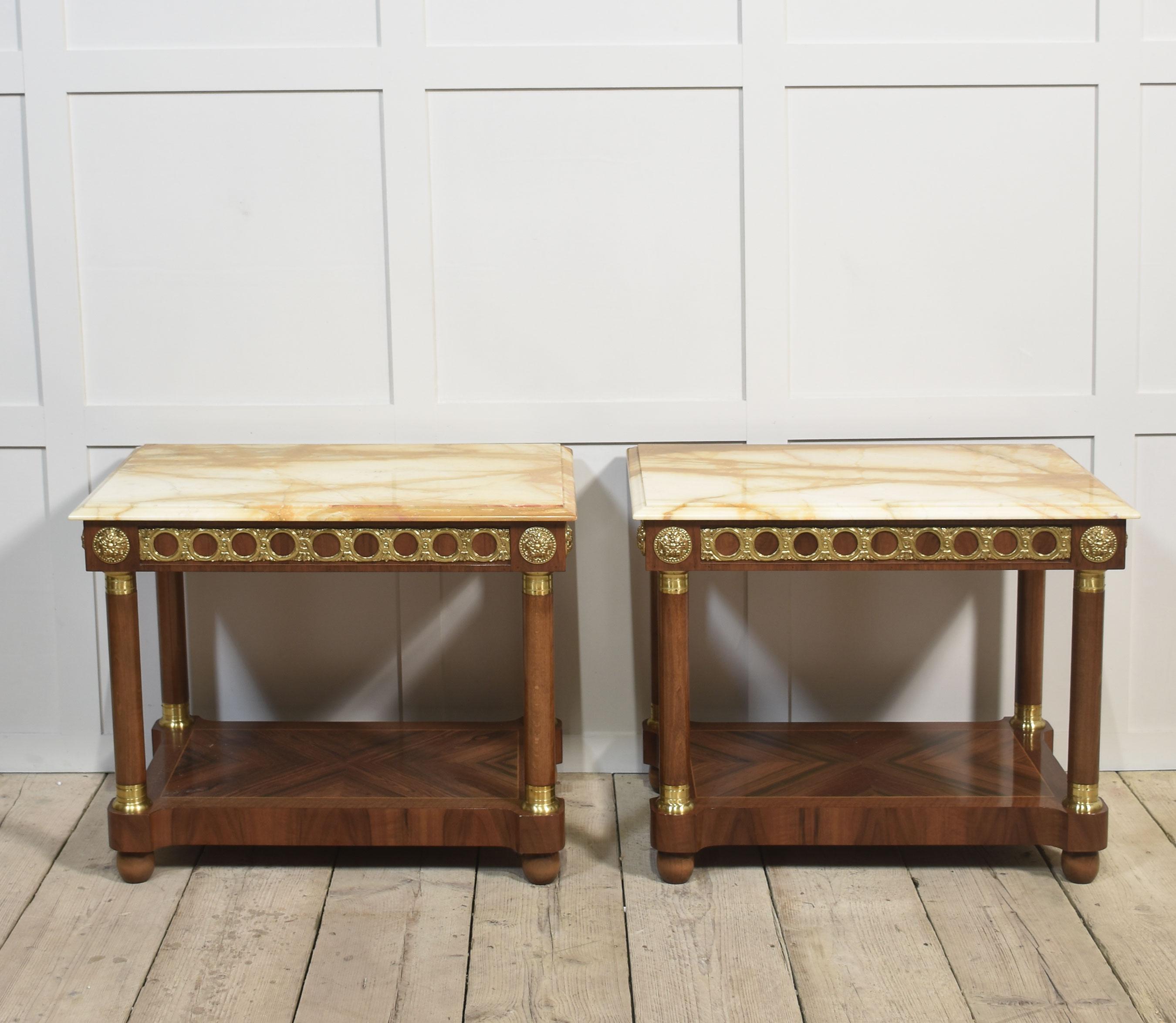 Pair of side tables, the well-figured marble tops with moulded edge, to the freeze with gilt metal mounted detail. Raised on circular supports united by under tier.
Dimensions
Height 24 Inches
Width 29.5 Inches
Depth 20 Inches