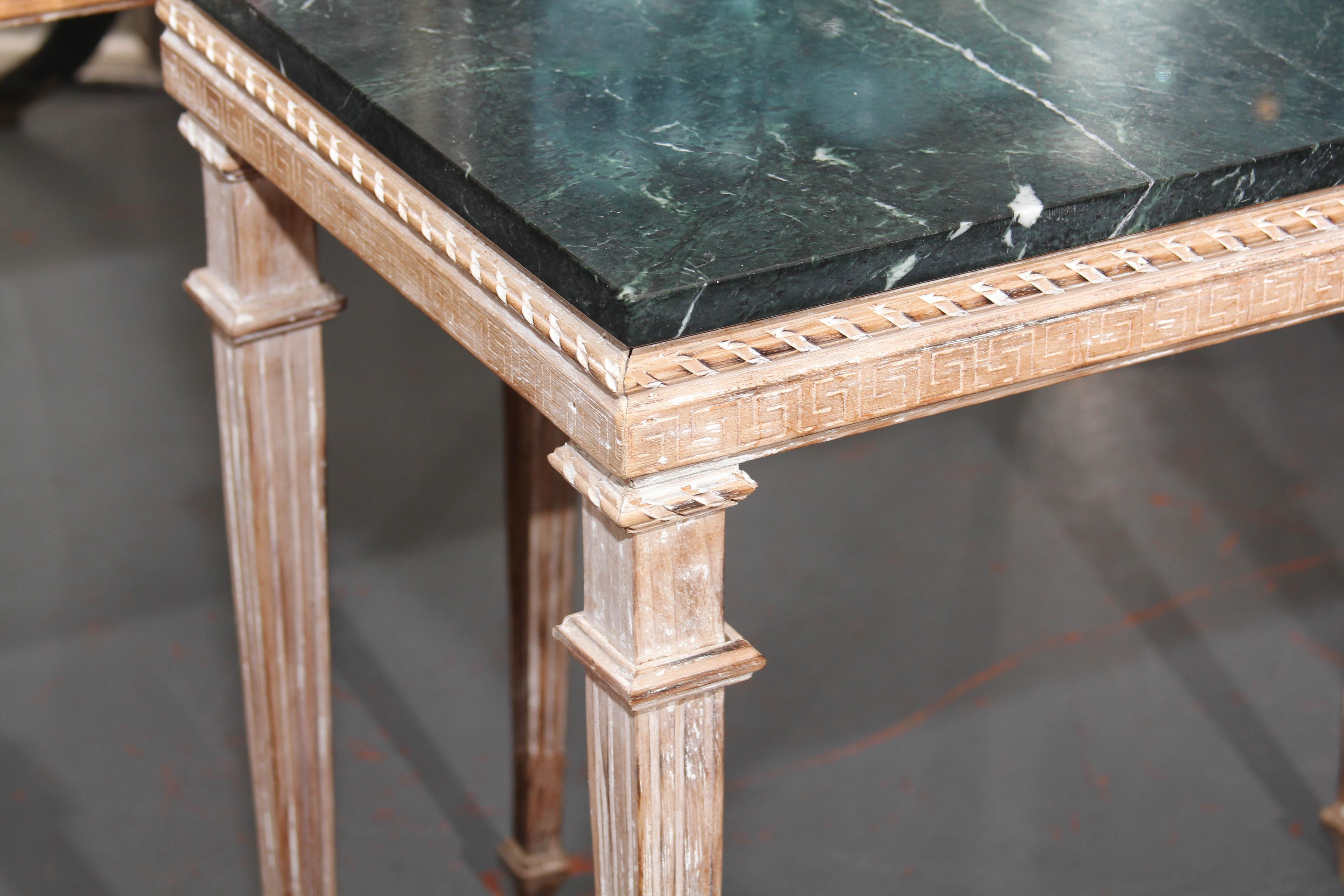 Pair tall wood with marble top side or console tables. Remnants of white paint remain on wood frames.