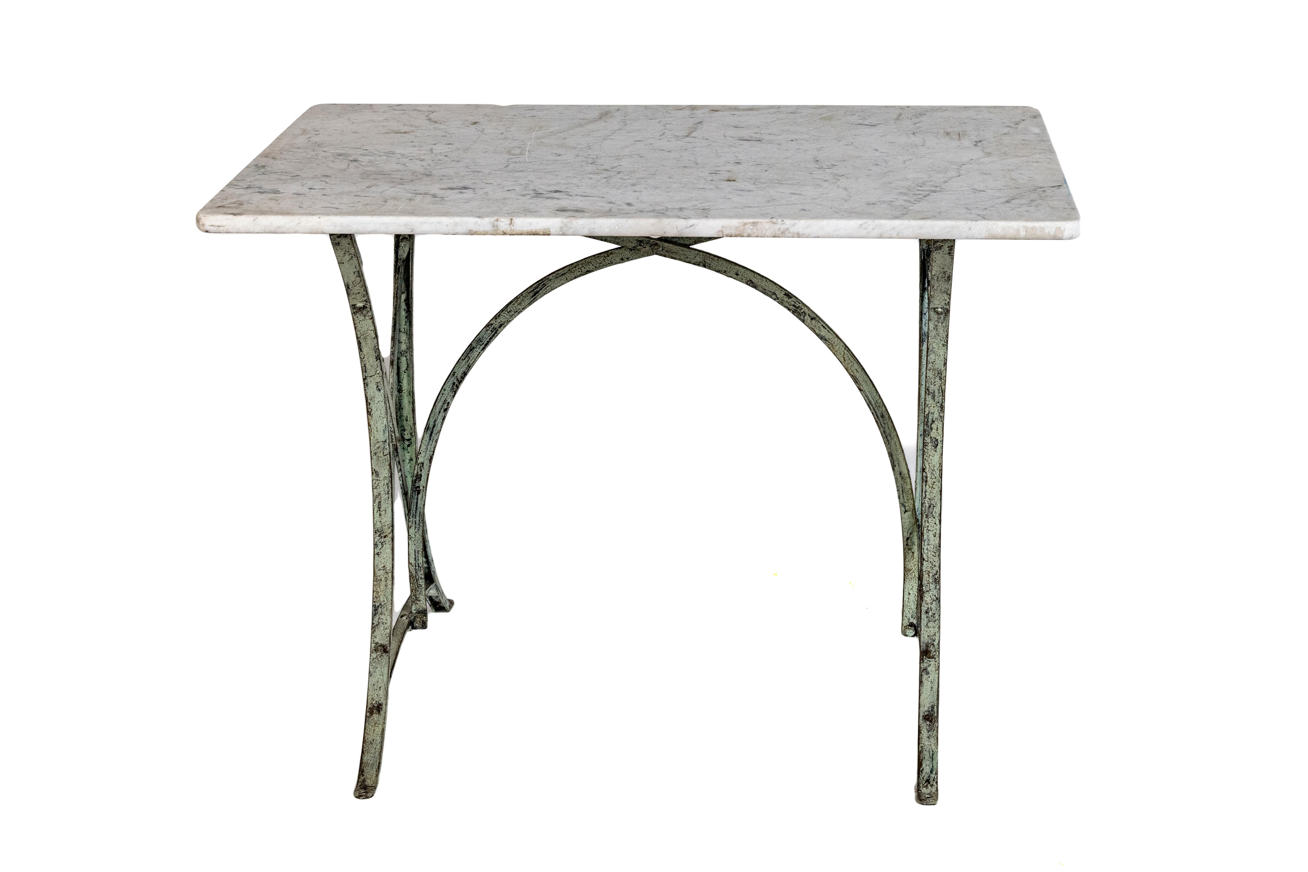 French wrought iron table bases with a beautiful original aged carrara marble tops .  Nice weathered patina.  Perfect for indoor or outdoor use.
Solid and sturdy.  These pieces would work great outdoors in a garden area or patio or indoors as