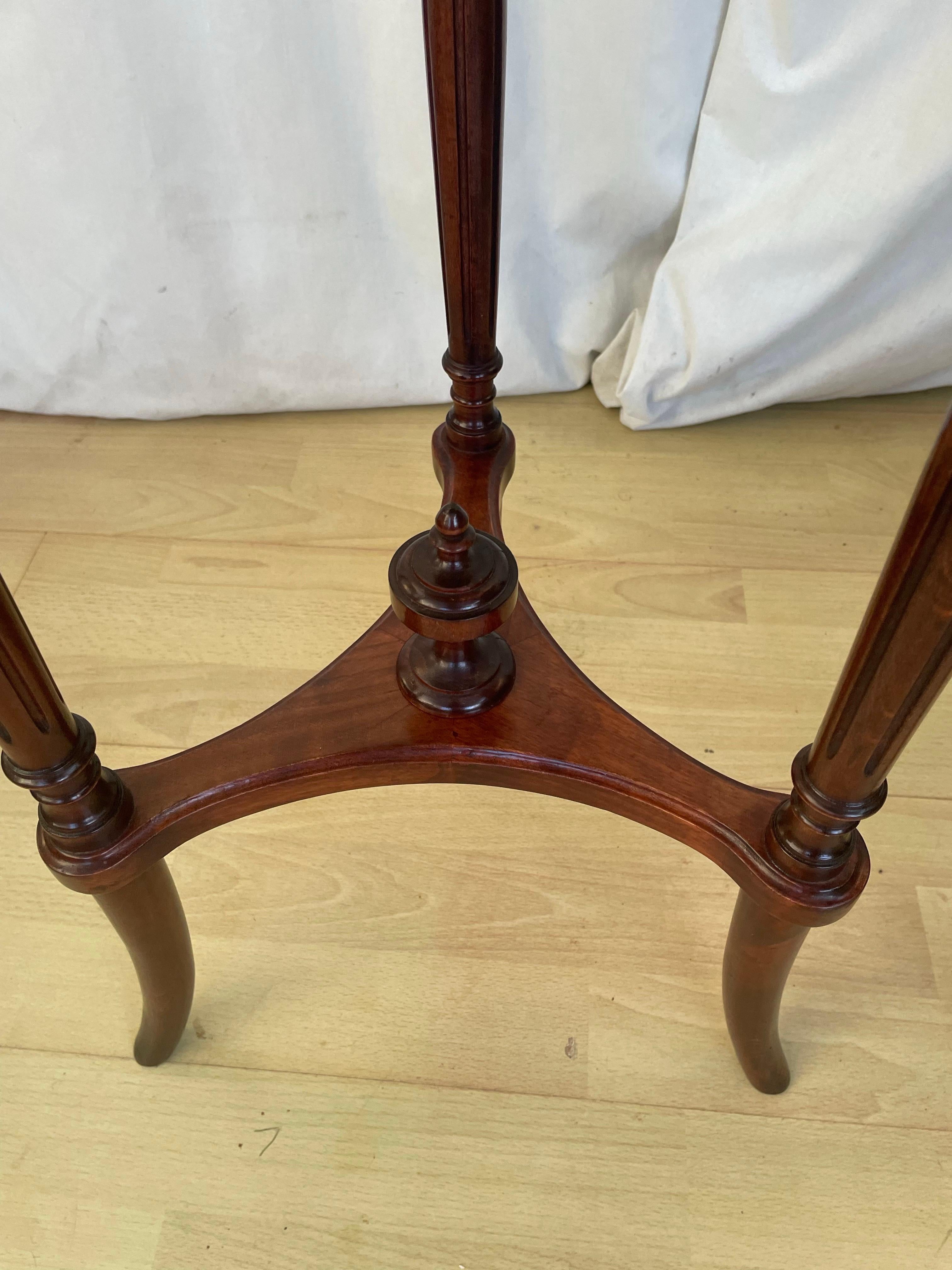 Pair of French beech and marble tables. 