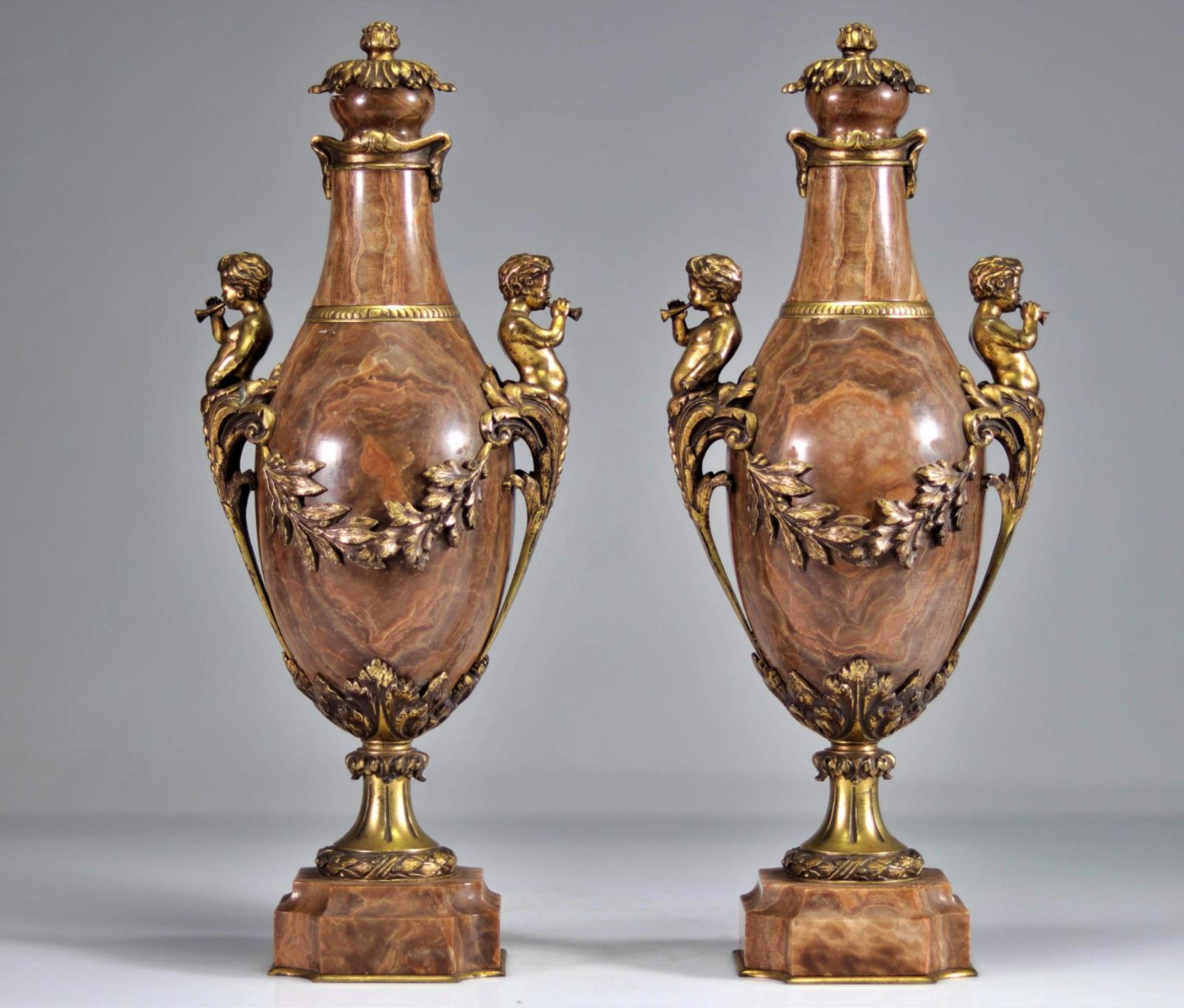 Pair of Marble Vases Decorated with Gilt Bronze Musical Fauns 19th century
Weight: 21.00 kg 
Sizes: H 50.0cm x L 20.0 
Good condition.