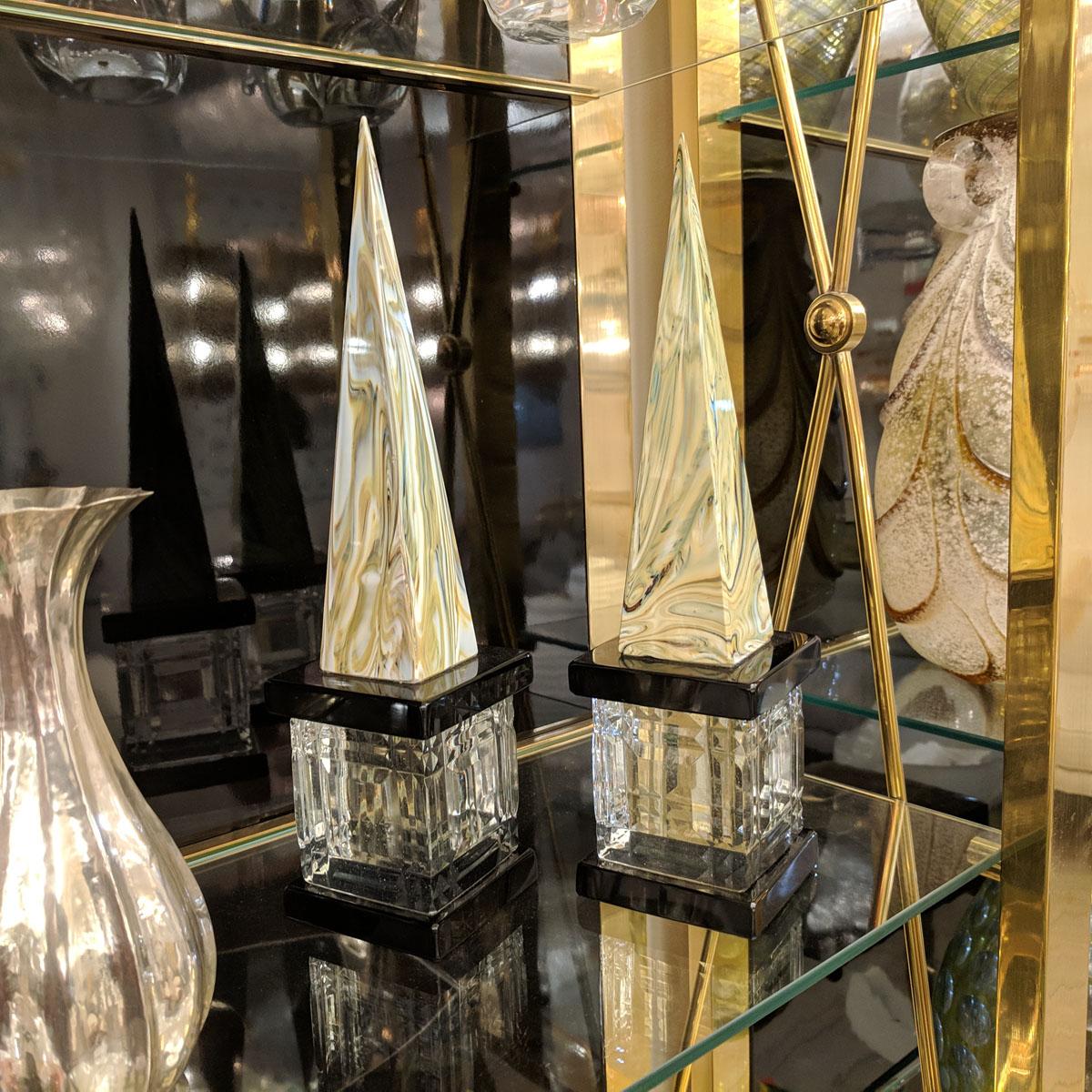 Pair of marbleized Murano glass obelisks with clear faceted glass bases.