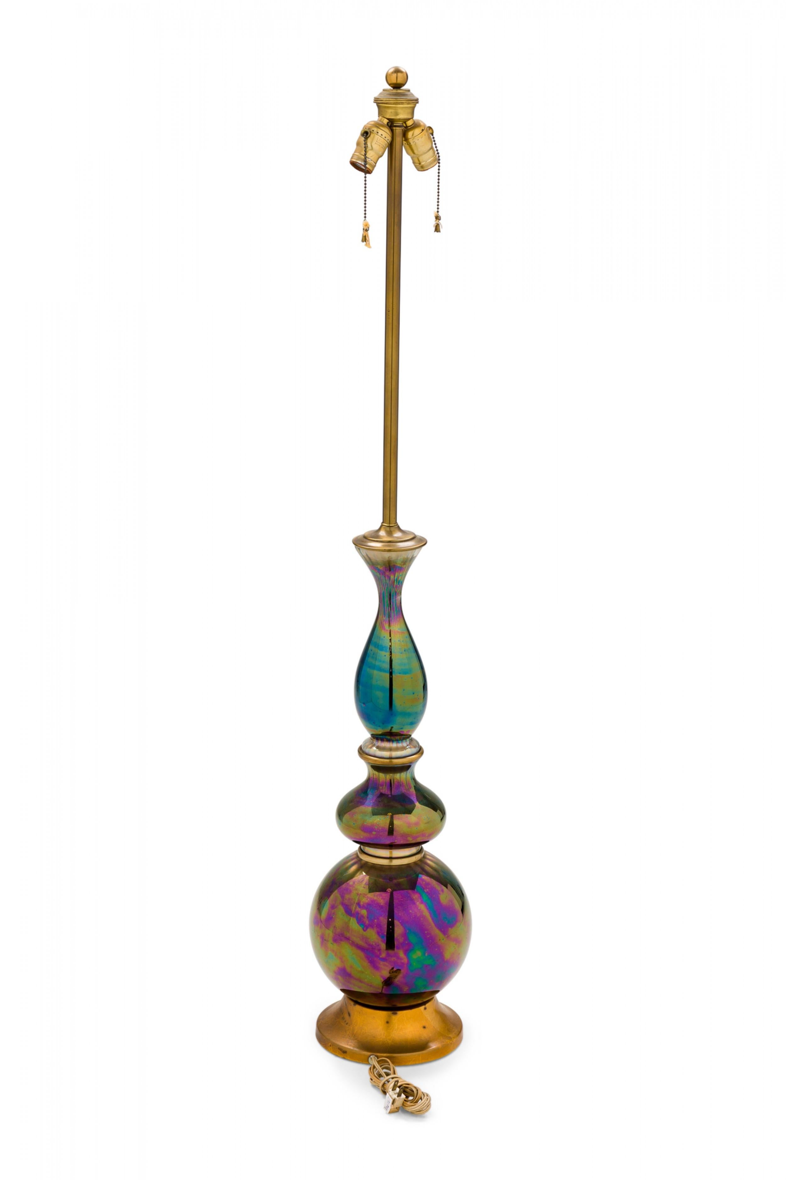 PAIR of Mid-Century (1950s) American iridescent green / blue / purple glass table lamps in spired globular form with towering functional brass light switch sockets plus beaded pulls, mounted on beveled gilt metal concave circular stands. (MARBRO