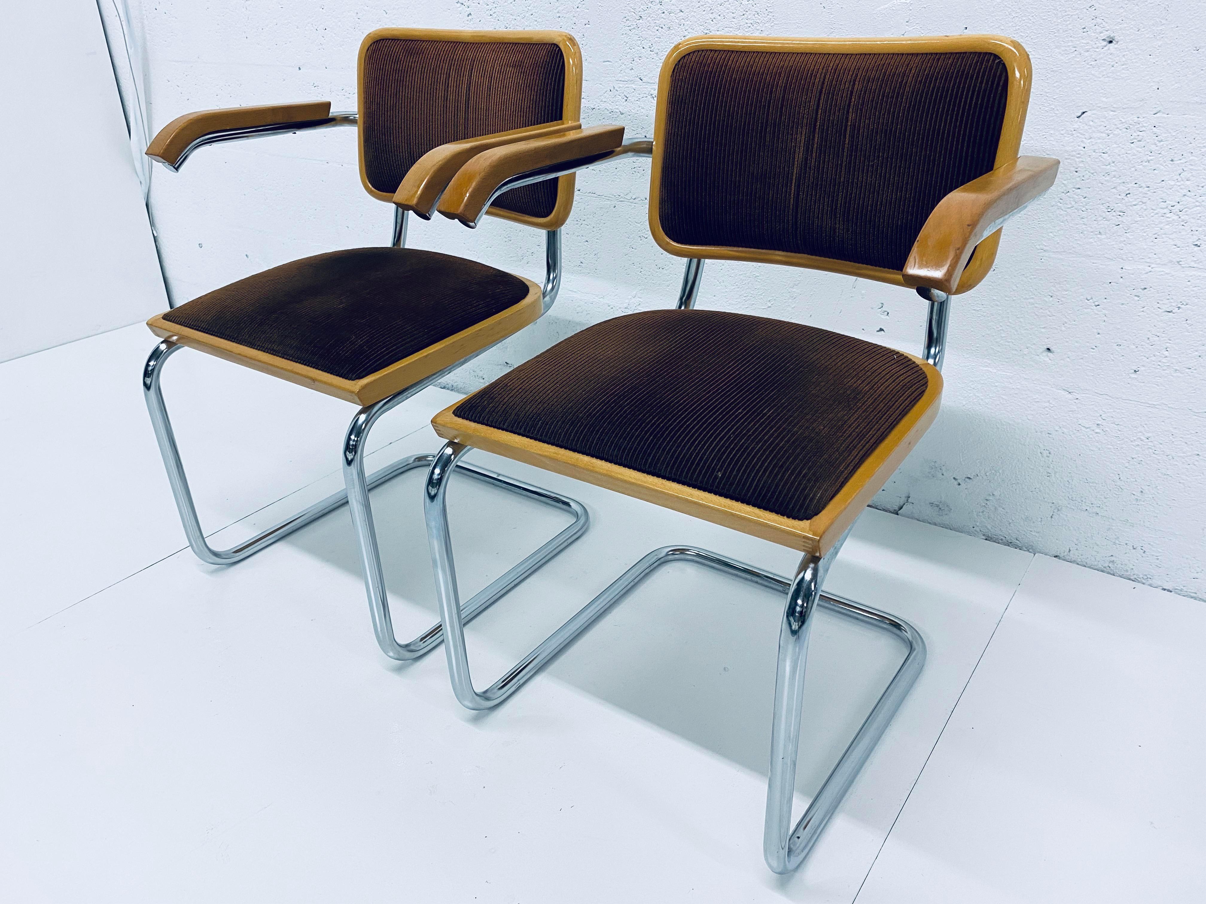 Two Marcel Breuer Bauhaus brown channeled velvet and tubular chrome dining or side armchairs made in Italy. Retains made in Italy labels.