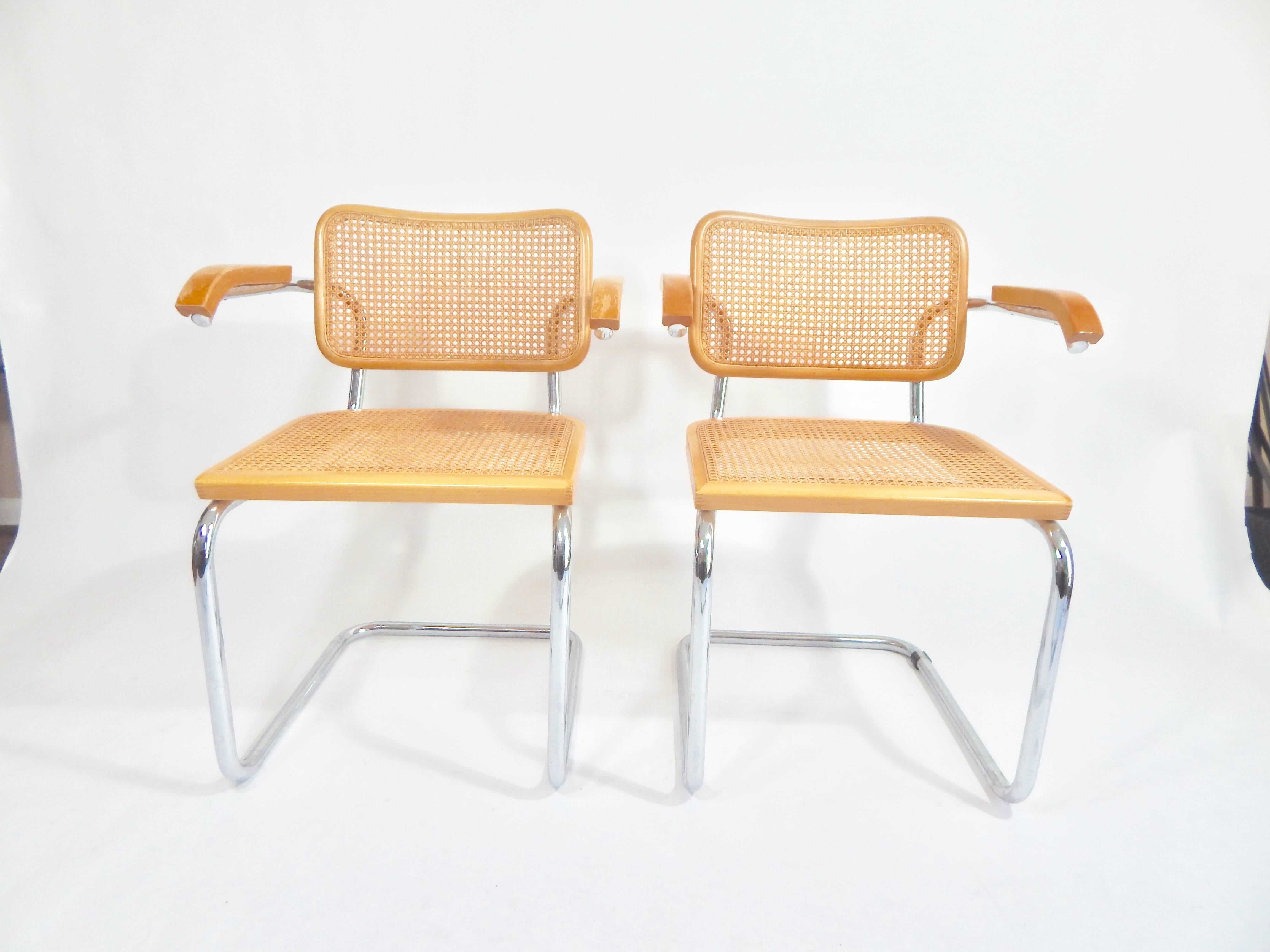 Midcentury pair of Marcel Breuer Cesca chairs, 1970s production. Both marked Made in Italy. Good original condition. Some wear to armrests.
Additional measurement: Top of armrest to floor 27.25.